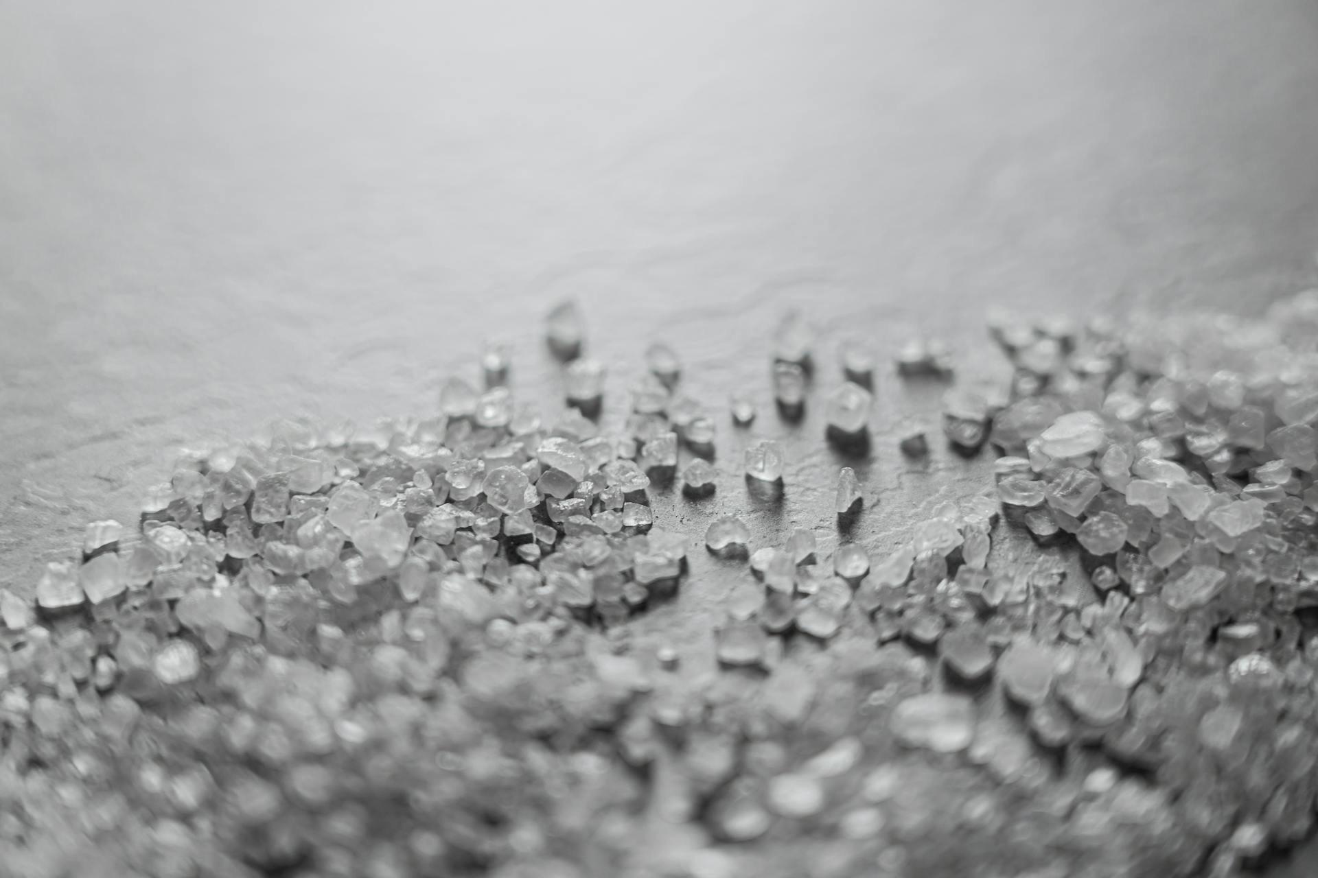 Clear Quartz Healing crystal chips sprinkled on a table