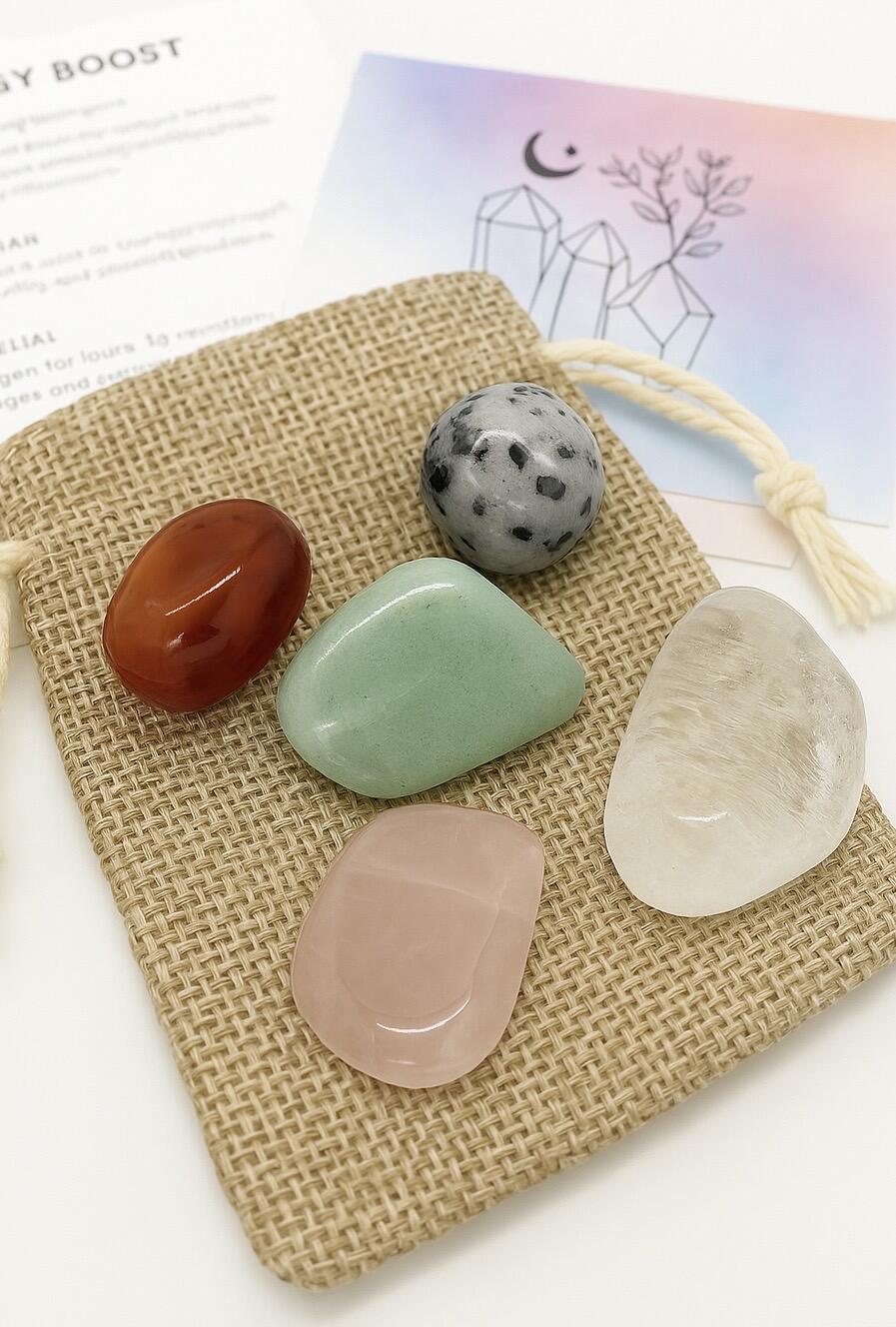 Fertility Healing Crystal Set, 5 crystals displayed on top of a bag