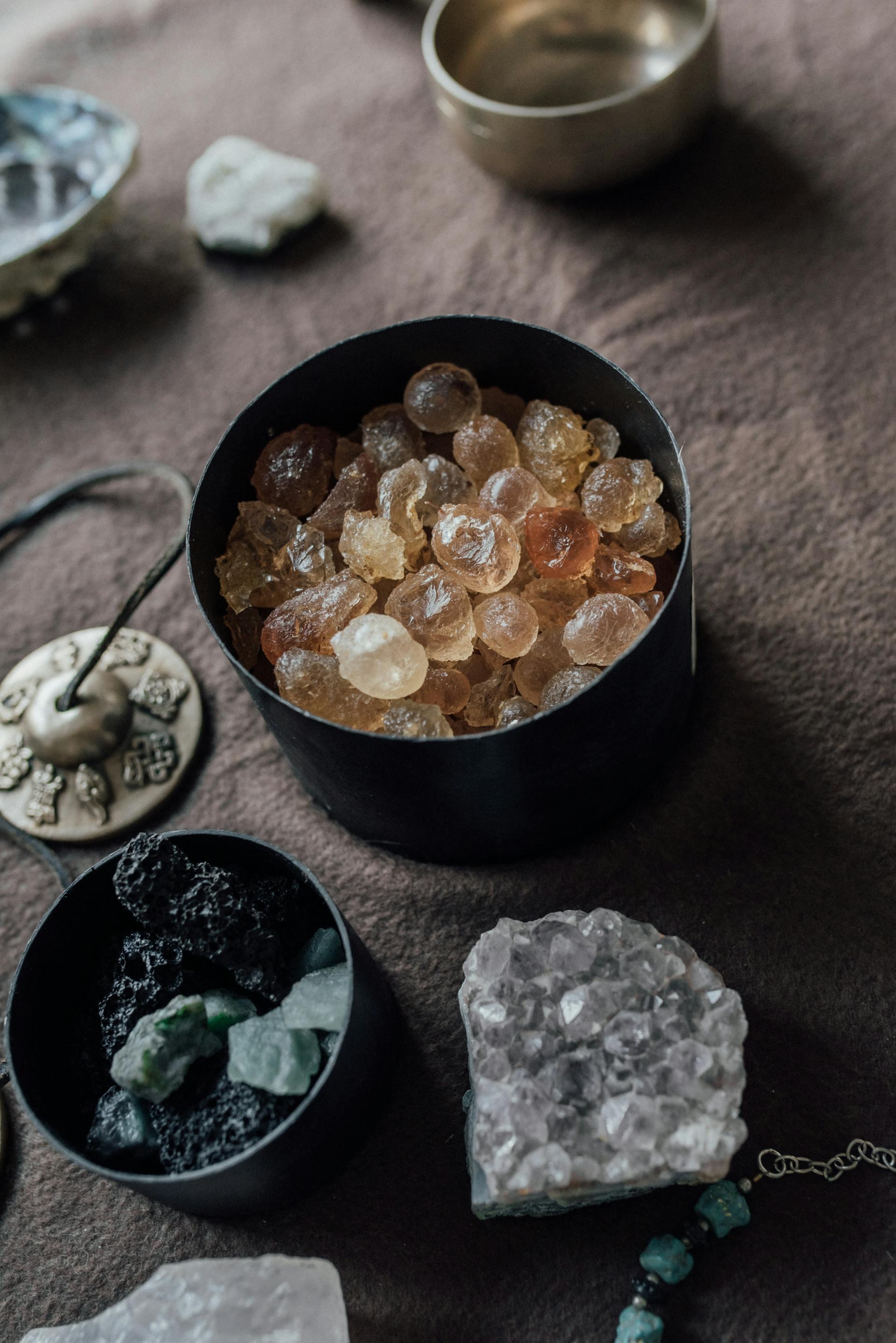 different crystals displayed in a bowl and some on a table