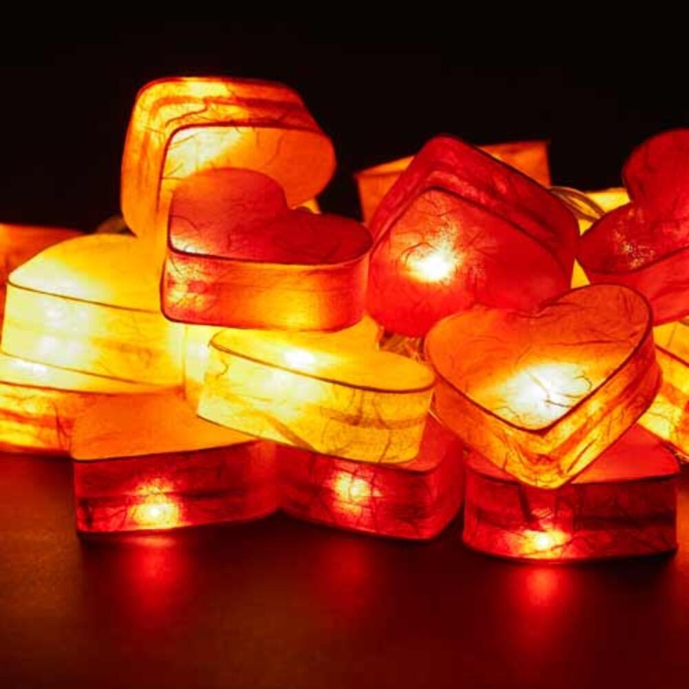 Handcrafted Radiant Heart 30 LED Fairy Lights in the Fire colourway. Hand-screened mulberry paper hearts with warm white LEDs. USB powered. UK 3-Pin USB plug included.