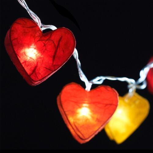 Handcrafted Radiant Heart 10 LED Fairy Lights in the Fire colourway. Hand-screened mulberry paper hearts with warm white LEDs. Mains powered. UK plug included.