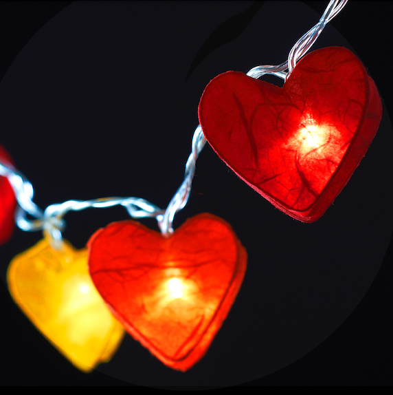 Handcrafted Radiant Heart 10 LED Fairy Lights in the Fire colourway. Hand-screened mulberry paper hearts with warm white LEDs. Mains powered. UK plug included.