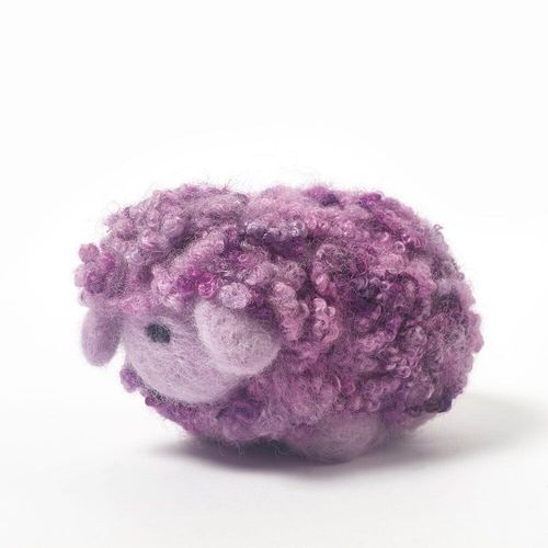 Raisin the Ice Cream Woollie needle felting kit box and a finished fluffy purple sheep with curly hand-dyed Blue Faced Leicester fleece.