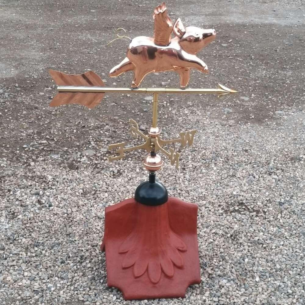 Flying pig weathervane installed on a ridge tile finial fitting with multiple angle options