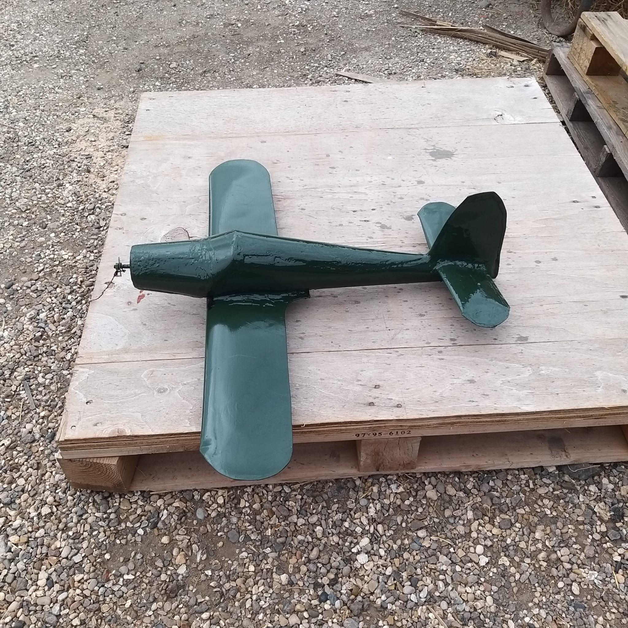 Opposite side view of the primed Spitfire weathervane showing the port side of the restored aircraft