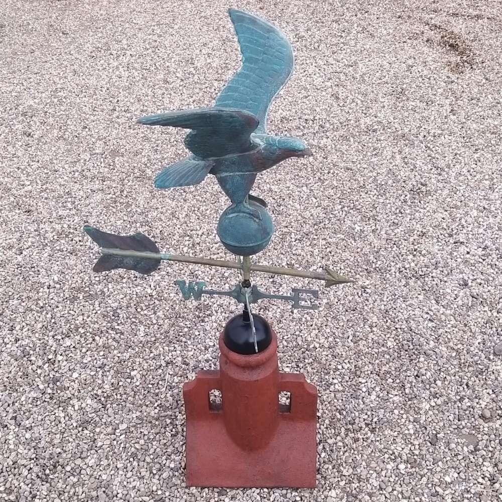 Eagle verdigris weathervane on a 90 degree ridge finial