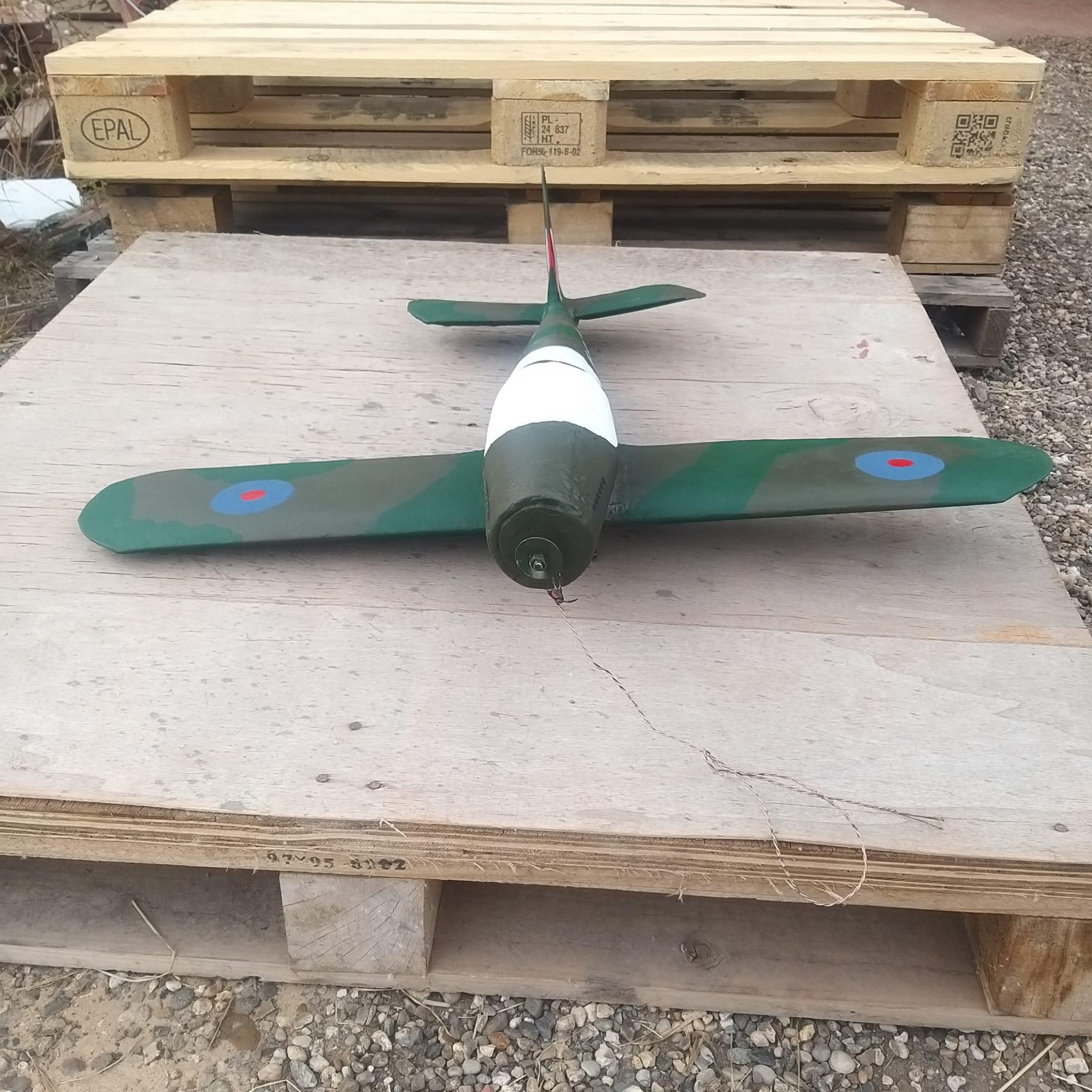 Hand painting commences on the Spitfire weathervane with RAF camouflage colours being applied