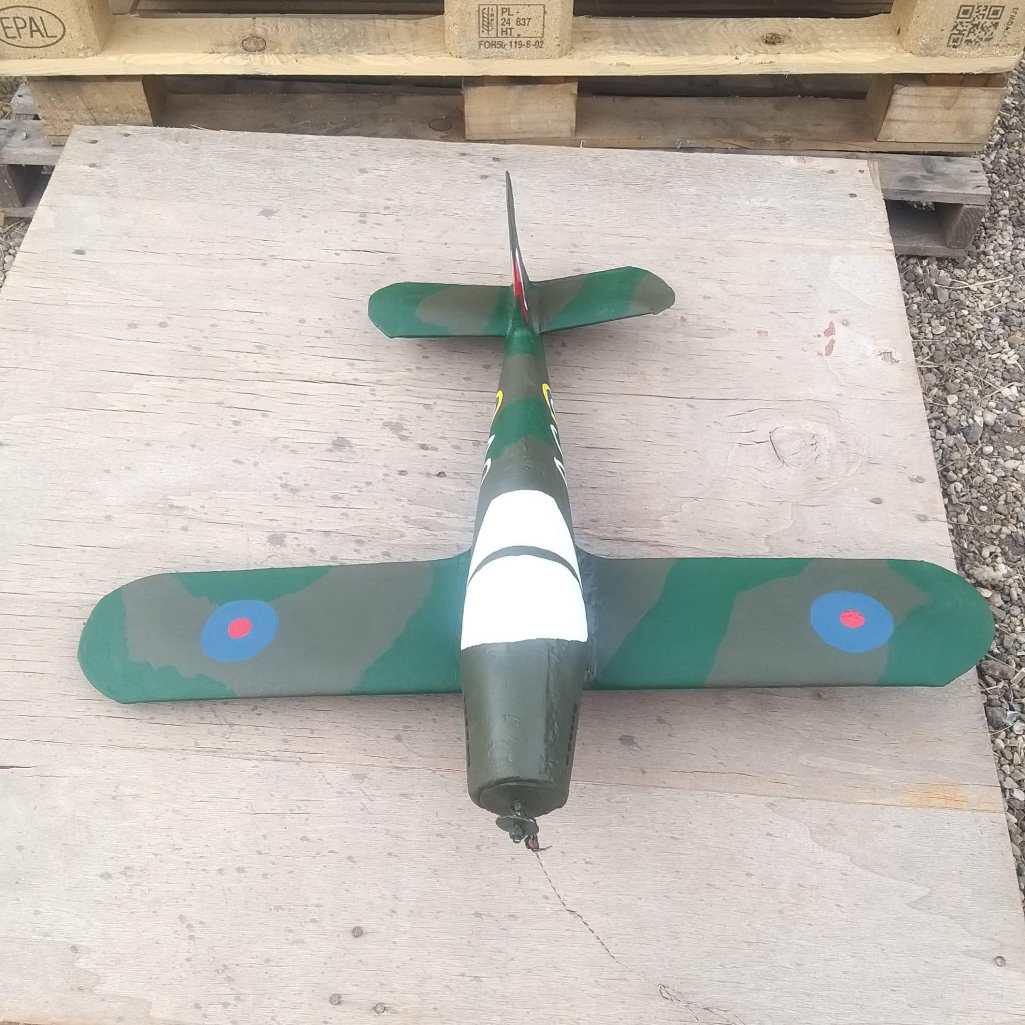 Second view of hand painting on the Spitfire weathervane with camouflage detail and markings emerging