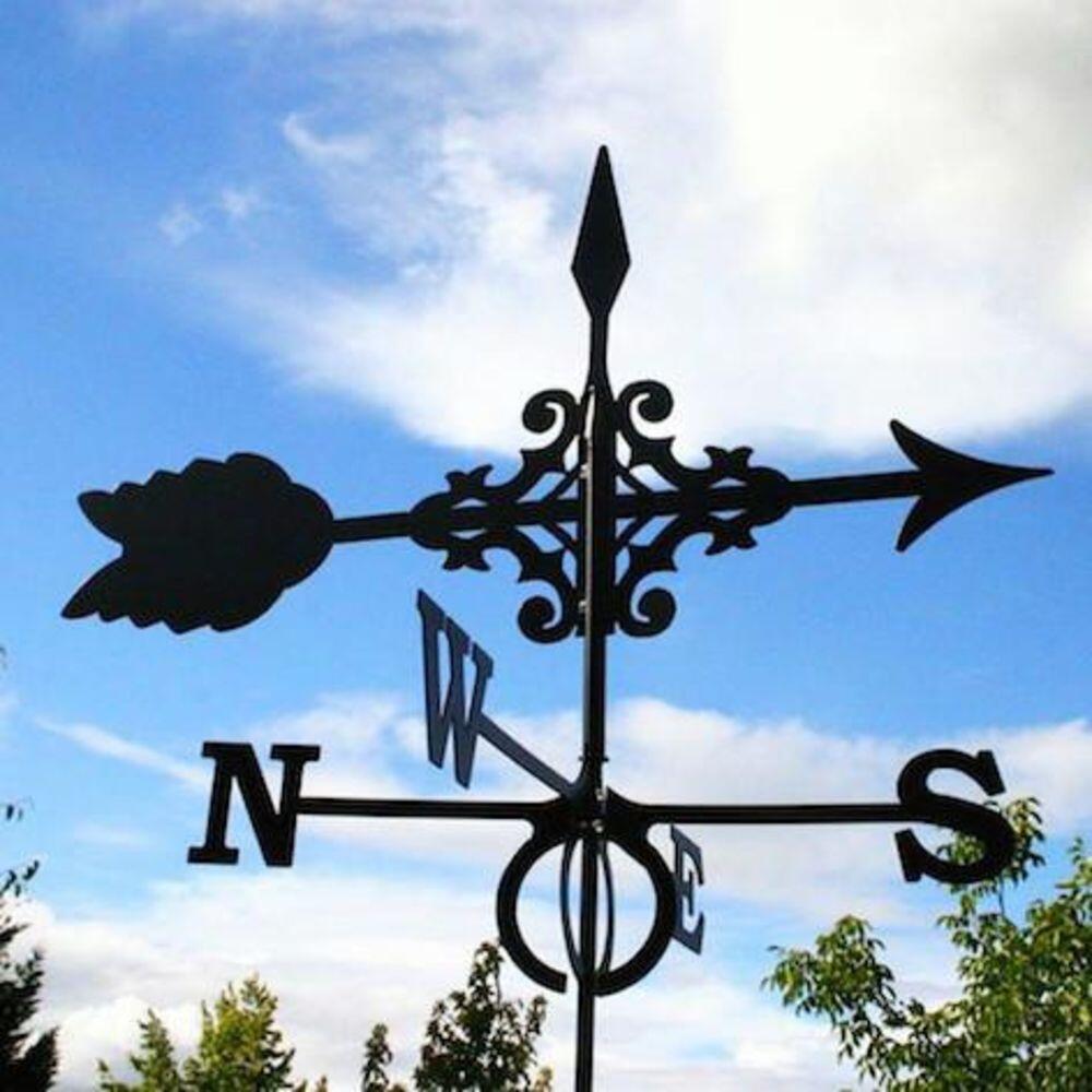 Large Gothic Arrow copper weathervane installed on a traditional roof showing decorative architectural detailing