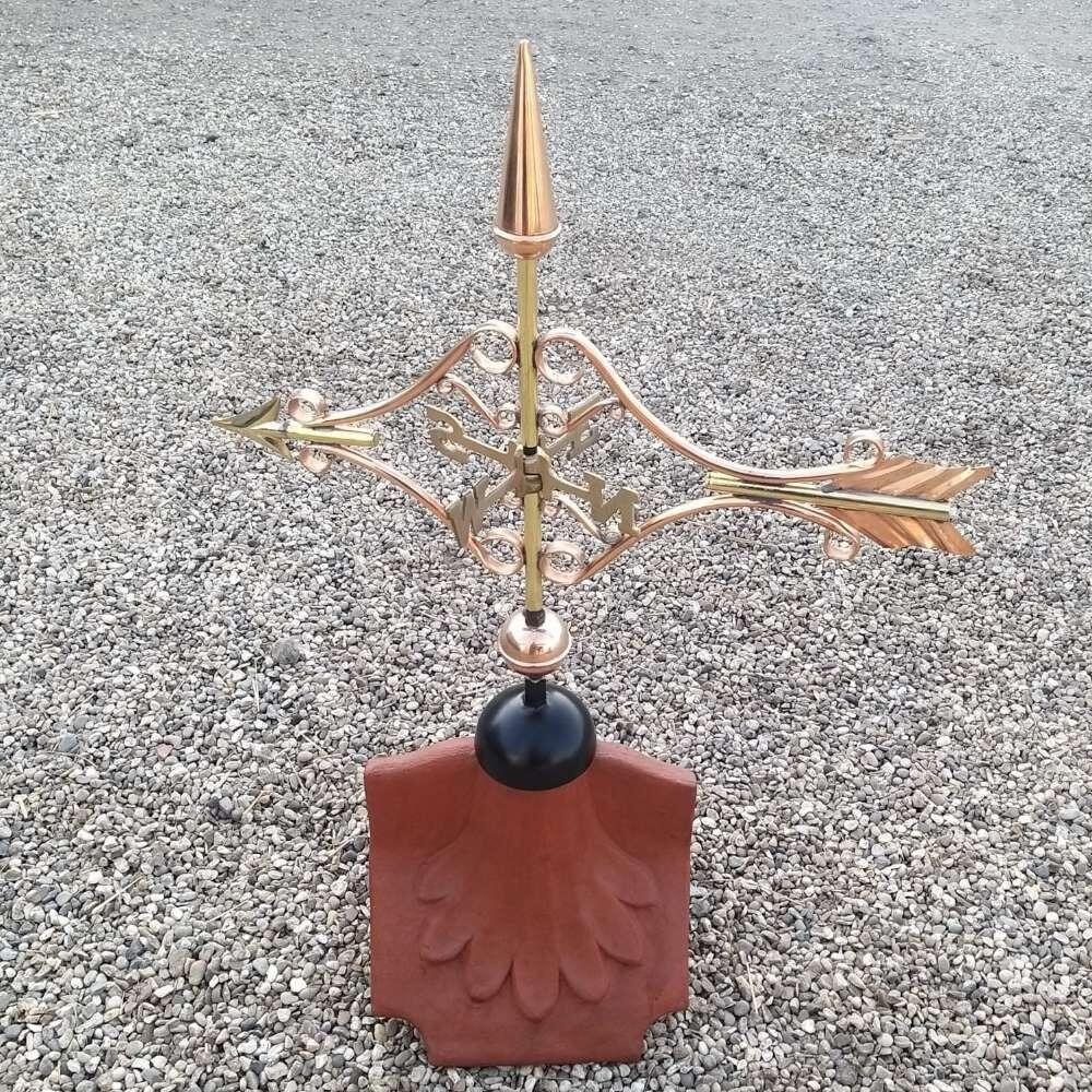 Victorian arrow weathervane installed on a ridge tile finial fitting with multiple angle options