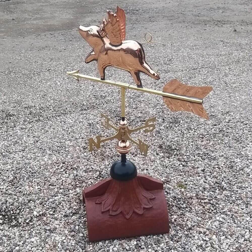 Flying pig weathervane supplied on a half round ridge