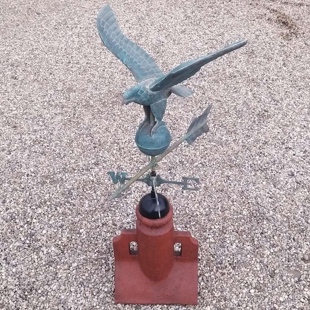 Eagle verdigris weathervane on a 90 degree ridge finial