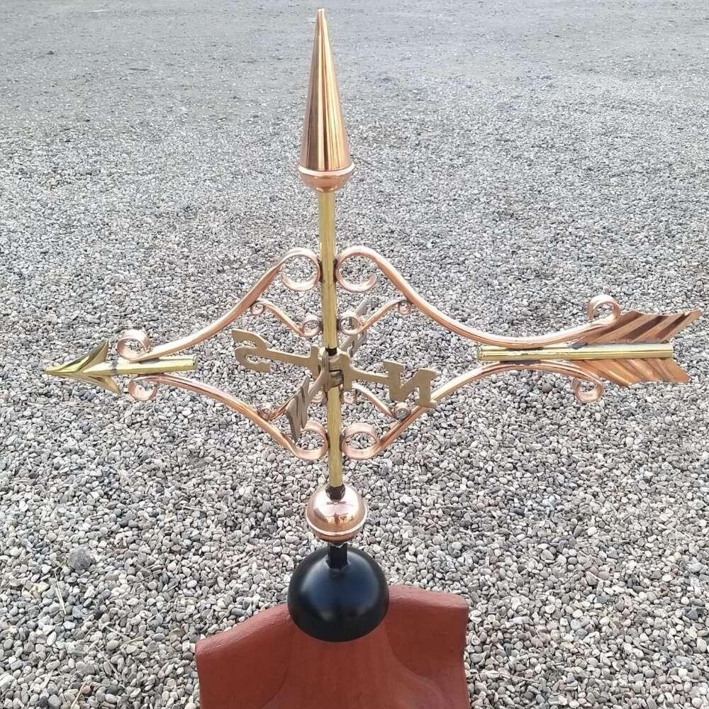 Victorian arrow weathervane installed on a ridge tile finial fitting with multiple angle options