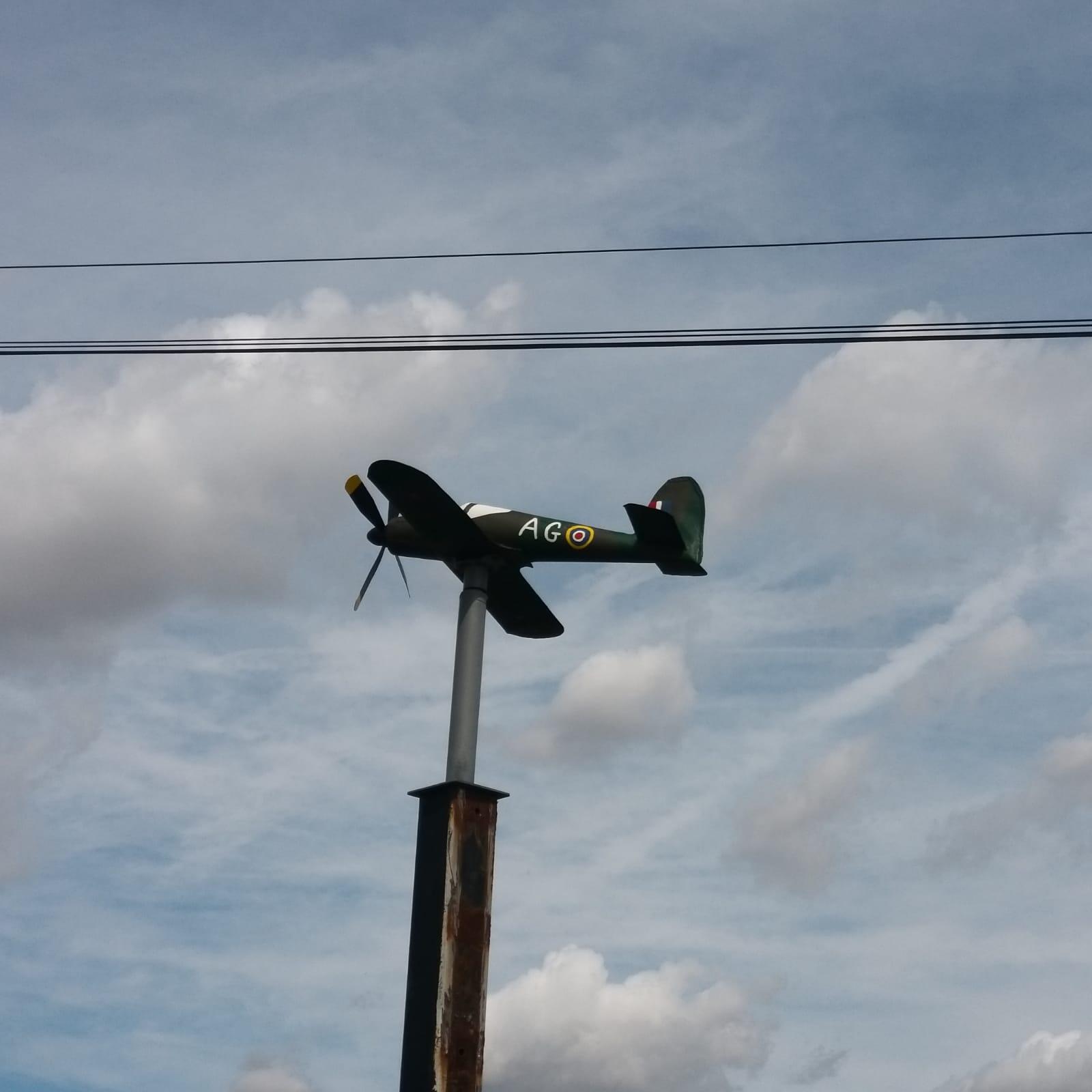 Second view of the restored Spitfire weathervane installed showing the completed aircraft from another angle