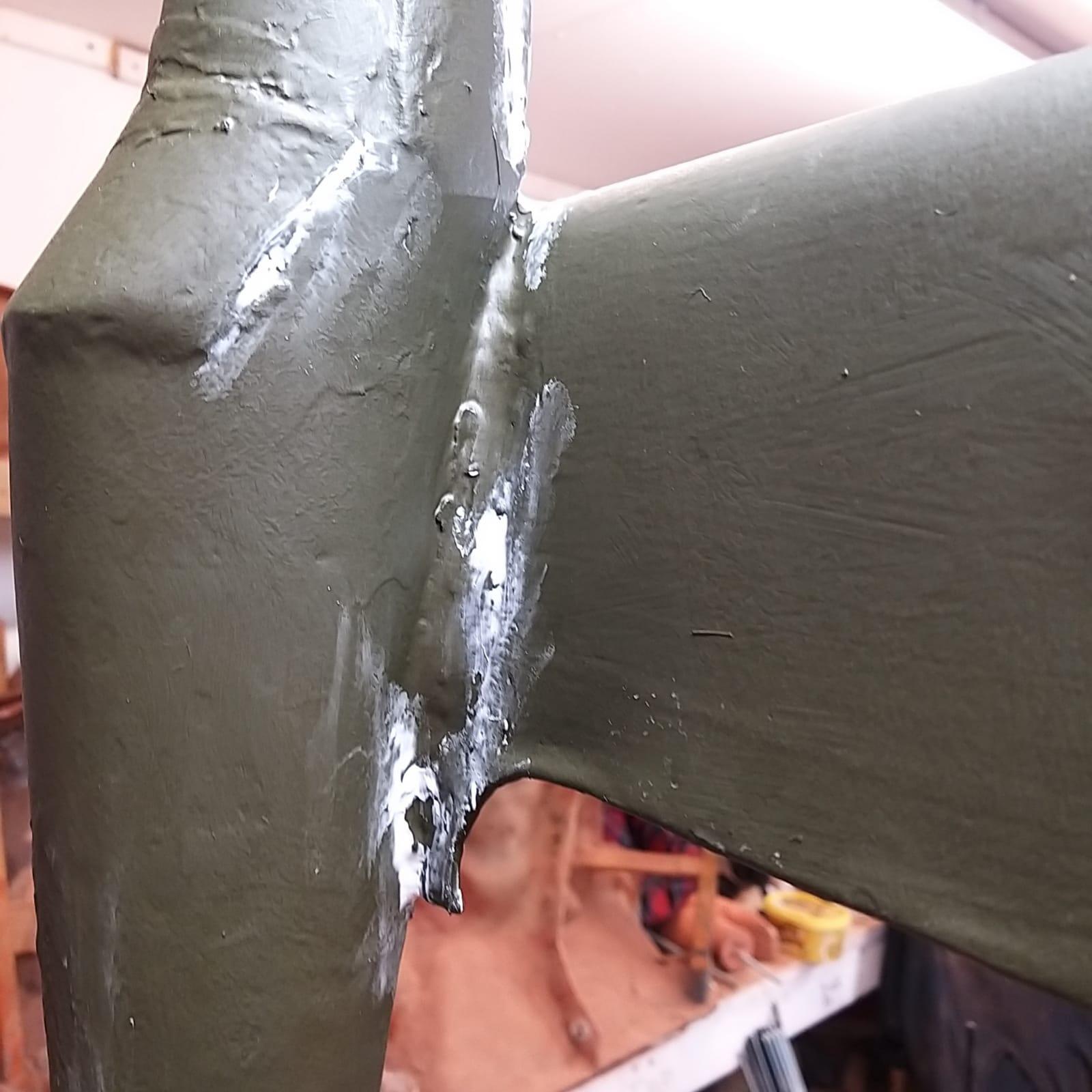 Spitfire weathervane with body filler applied beginning the repair and restoration process