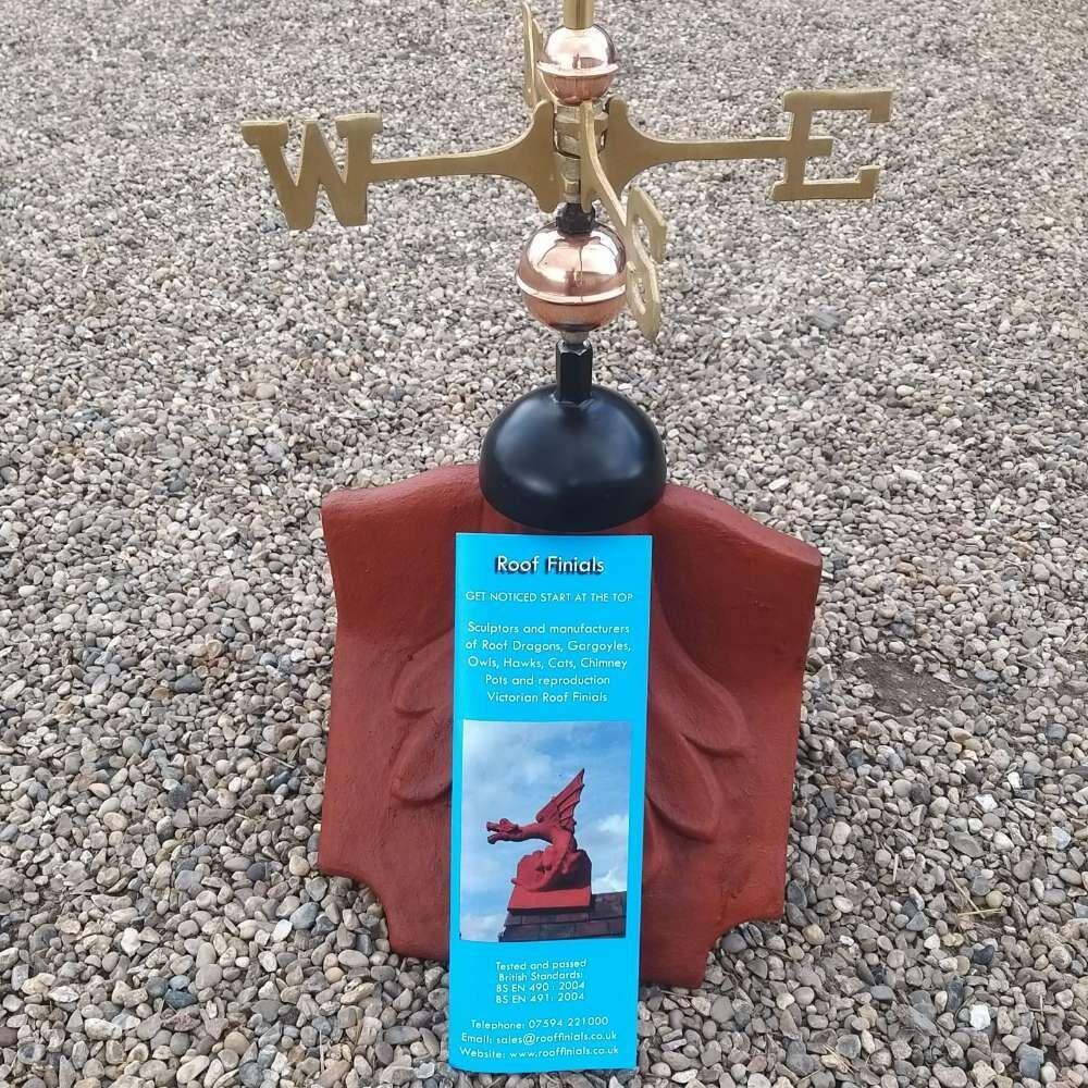 Banner weathervane supplied on a ridge tile finial fitting with multiple angle options