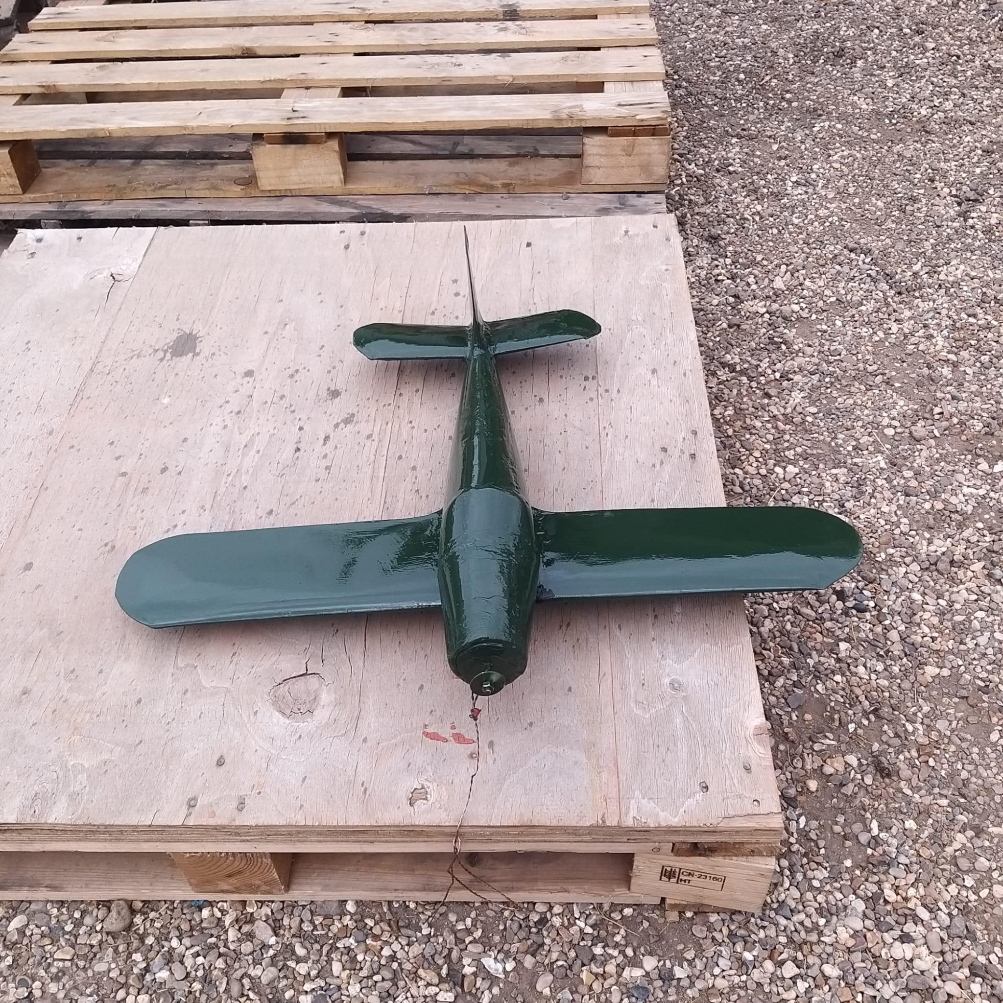 Spitfire weathervane fully primed in grey primer drying outside before hand painting commences