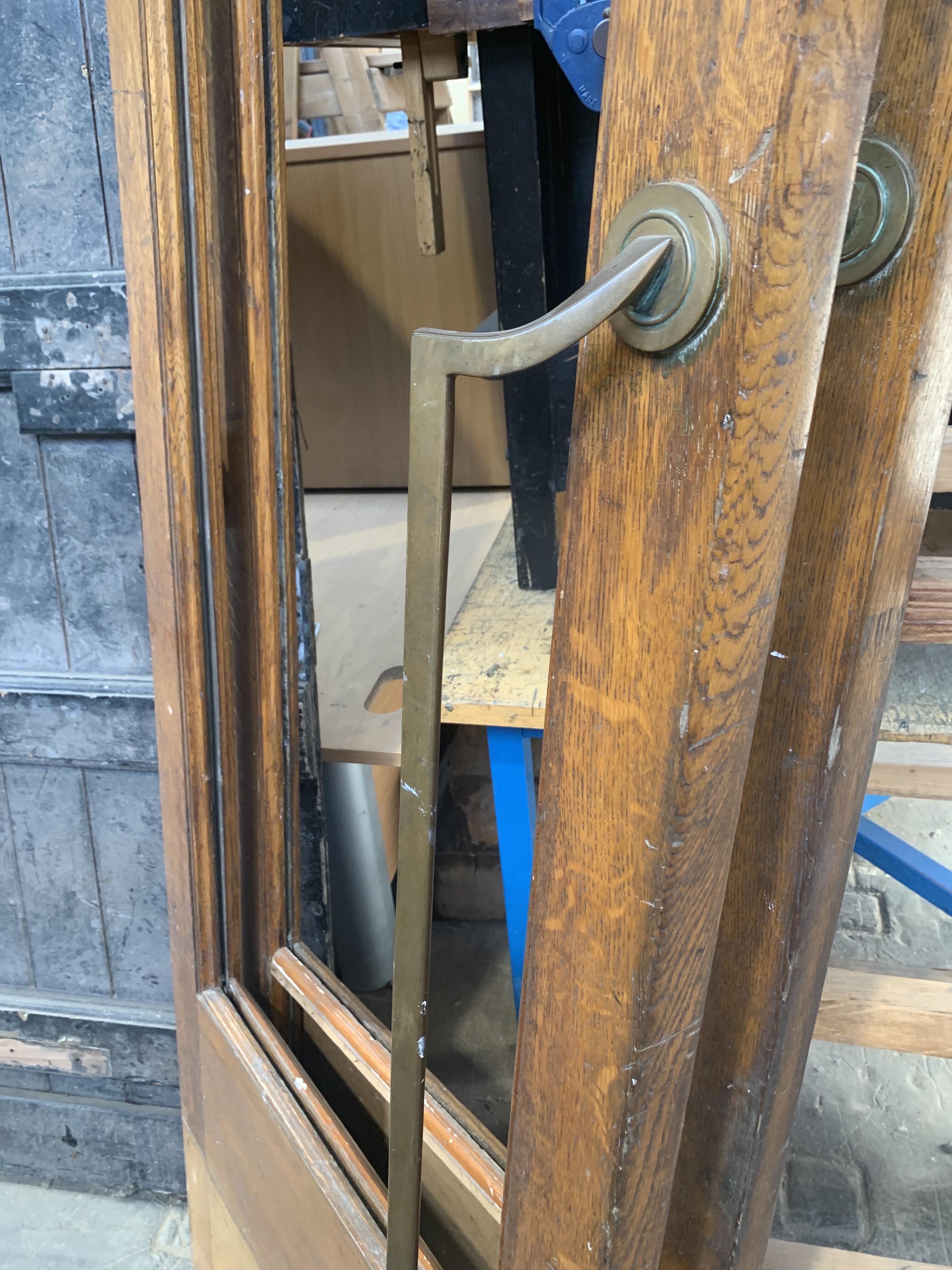 Pair of Reclaimed Wooden Doors with Missing Windows