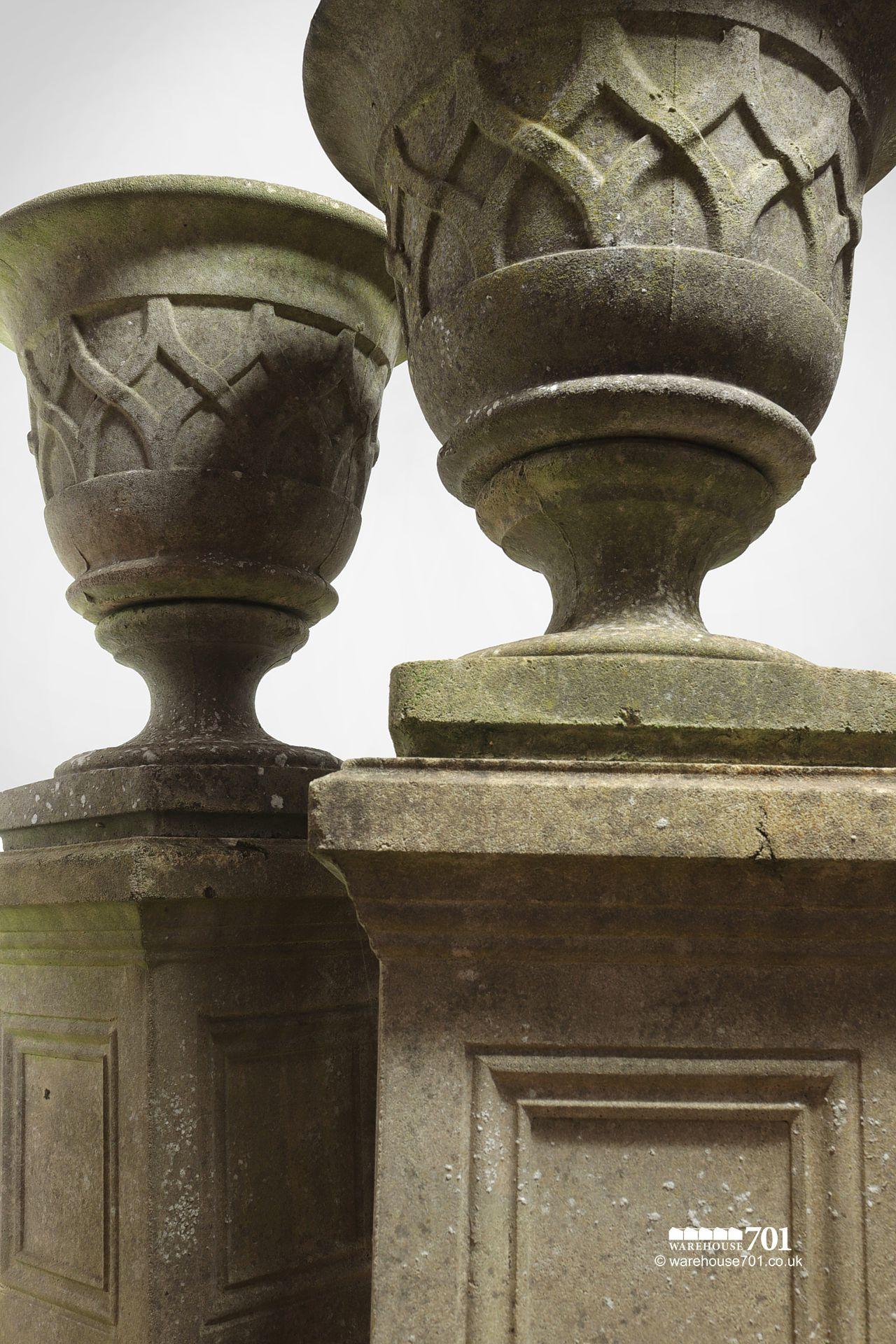 Pair of Vintage Composite Stone Lattice Pattern Urns on Plinths