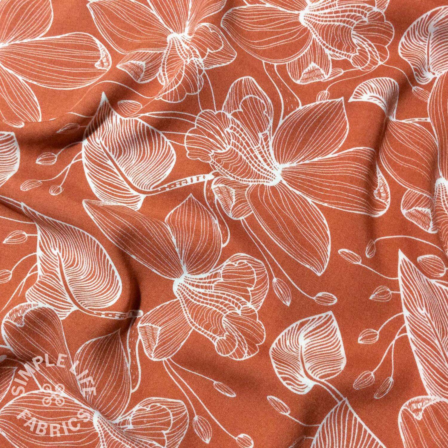 Viscose floral dressmaking fabric red orchids