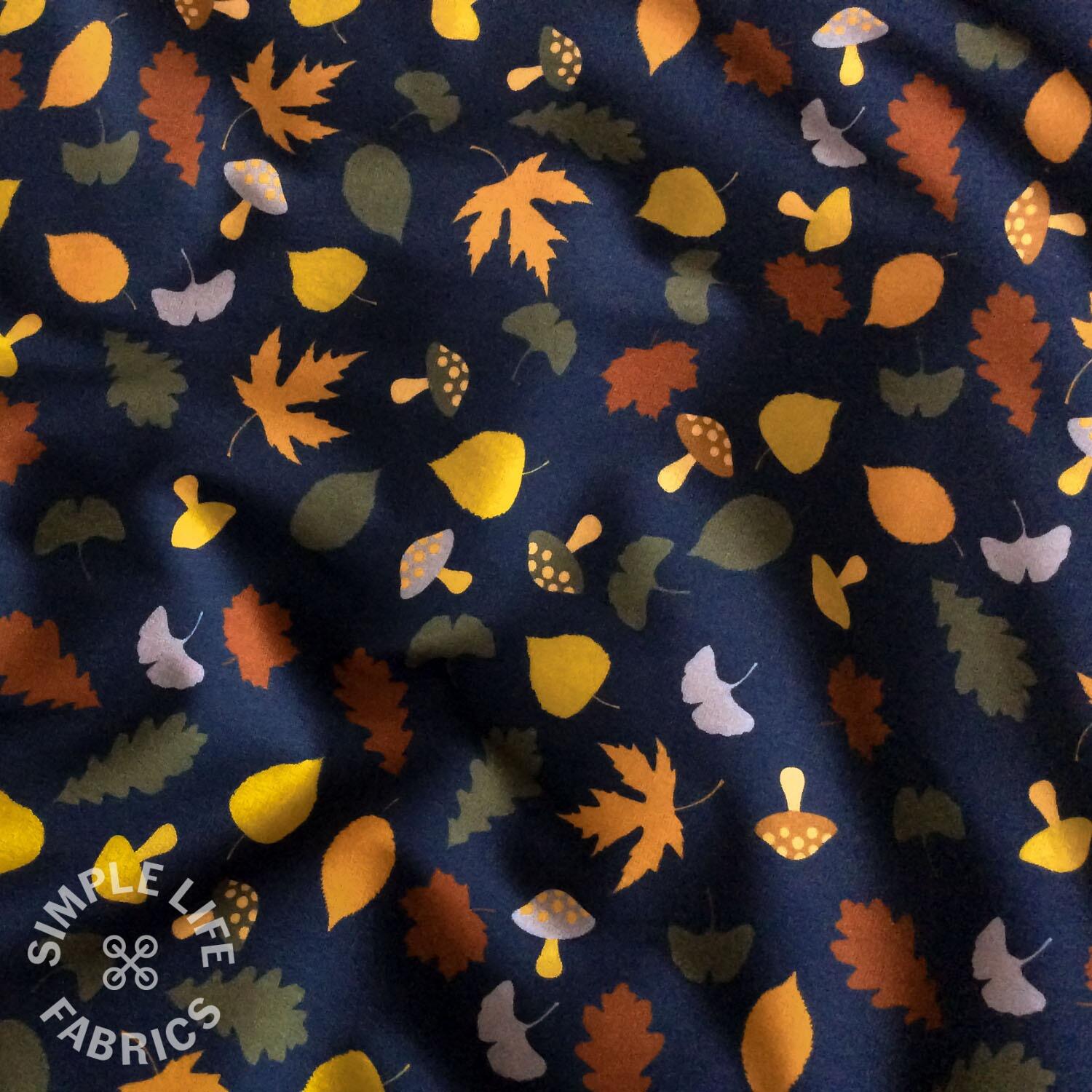 Autumn leaves and toadstools French terry fabric