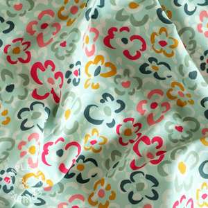 Modern floral babycord green fabric