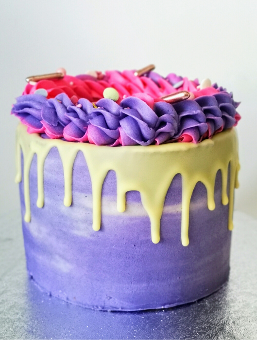 2 tone white chocolate sprinkles drip cake  side view