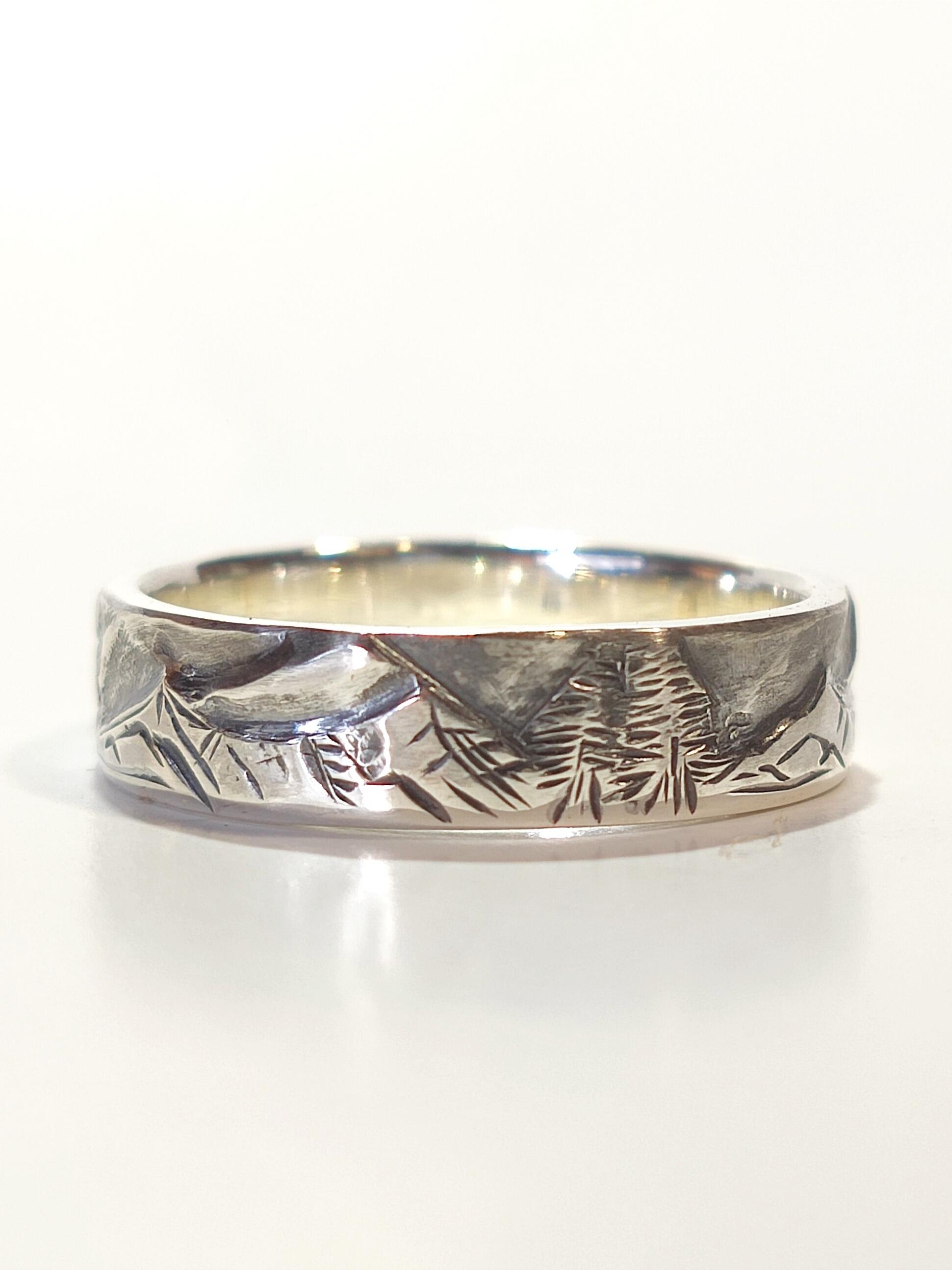 Silver band outlet ring engraved