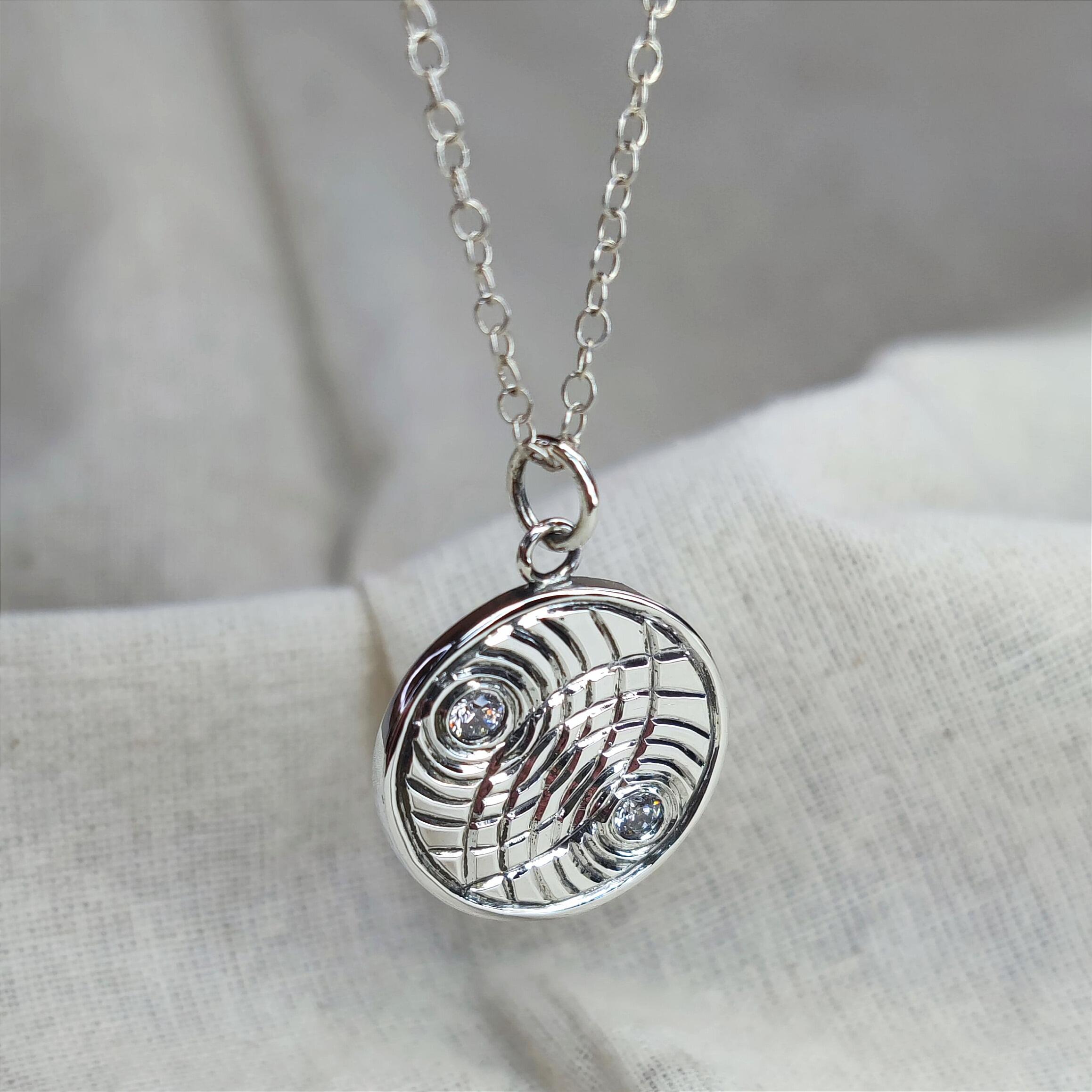 Hand Engraved Double Ripple Pendant with Cubic Zirconia, handmade with recycled sterling silver.