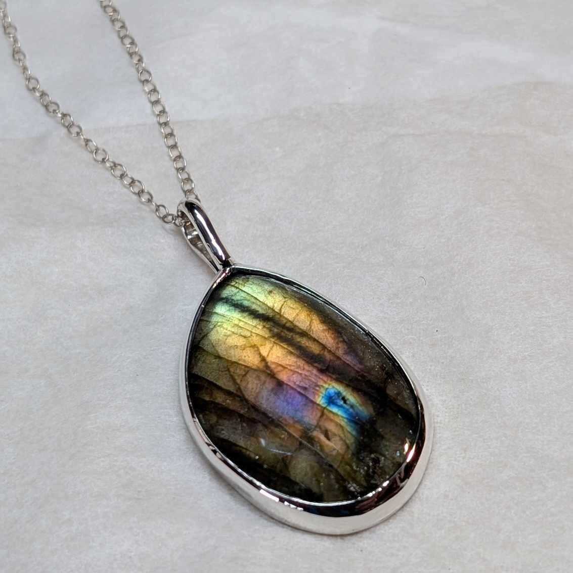 Freeform Labradorite Pendant with Celtic Engraving on the reverse, handmade in Scotland with recycled sterling silver