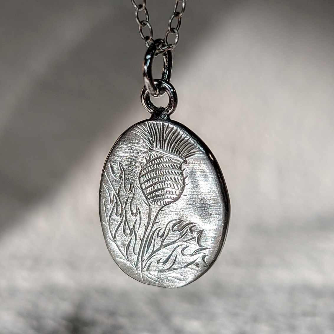 Pebble Pendant with hand engraved Scottish Thistle design, with brush finish, handmade with recycled sterling silver.