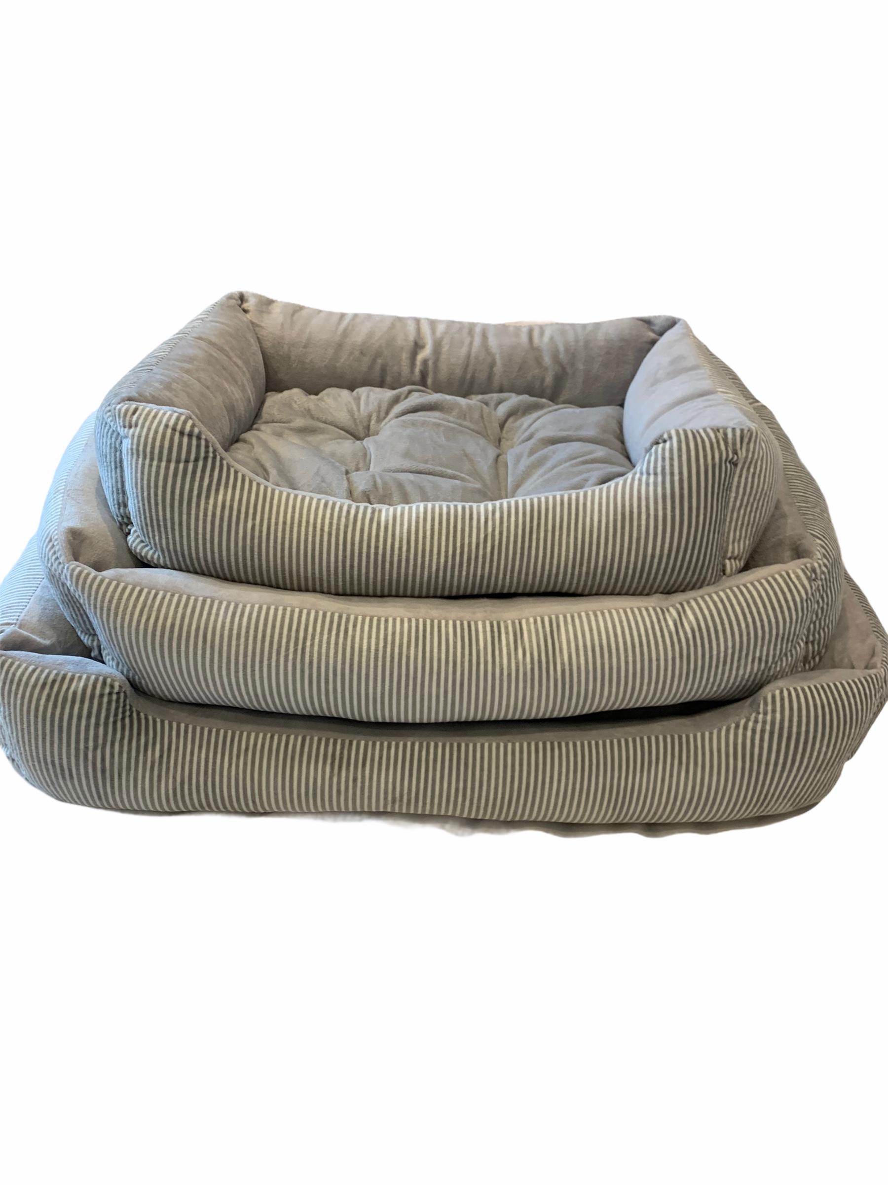 Stacked light striped dog beds