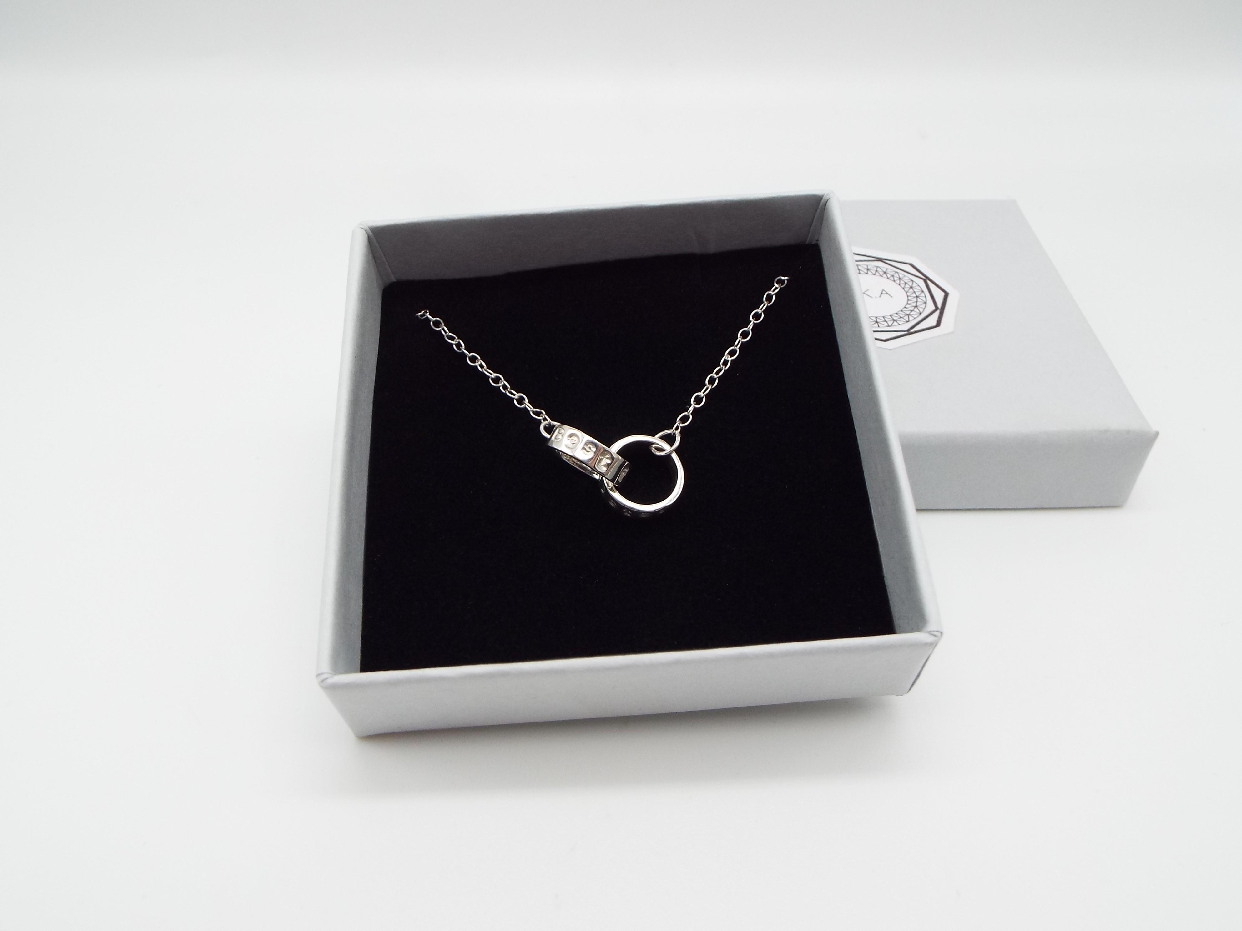 Silver charm necklace in a gift box