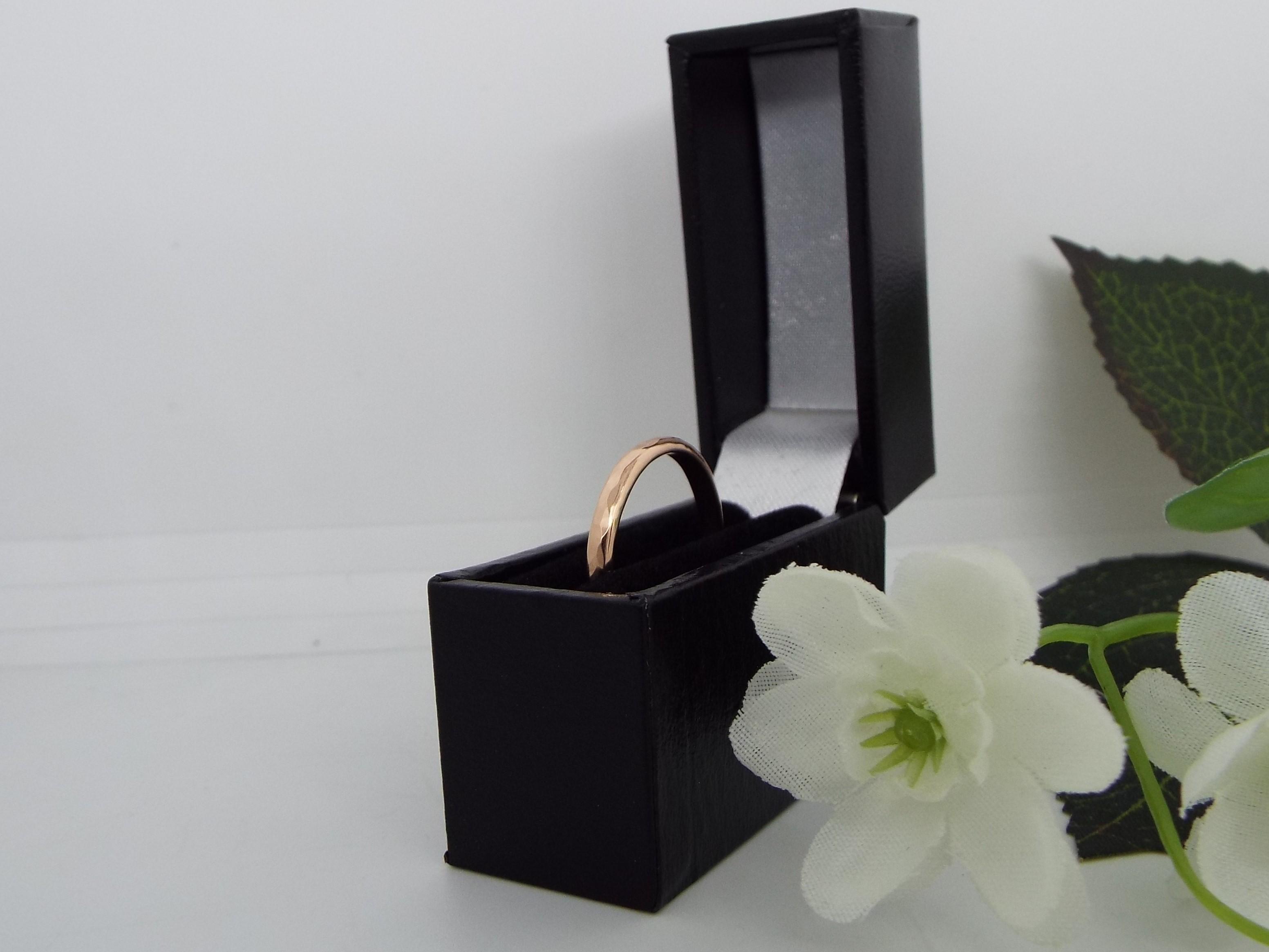rose gold wedding ring in a gift box