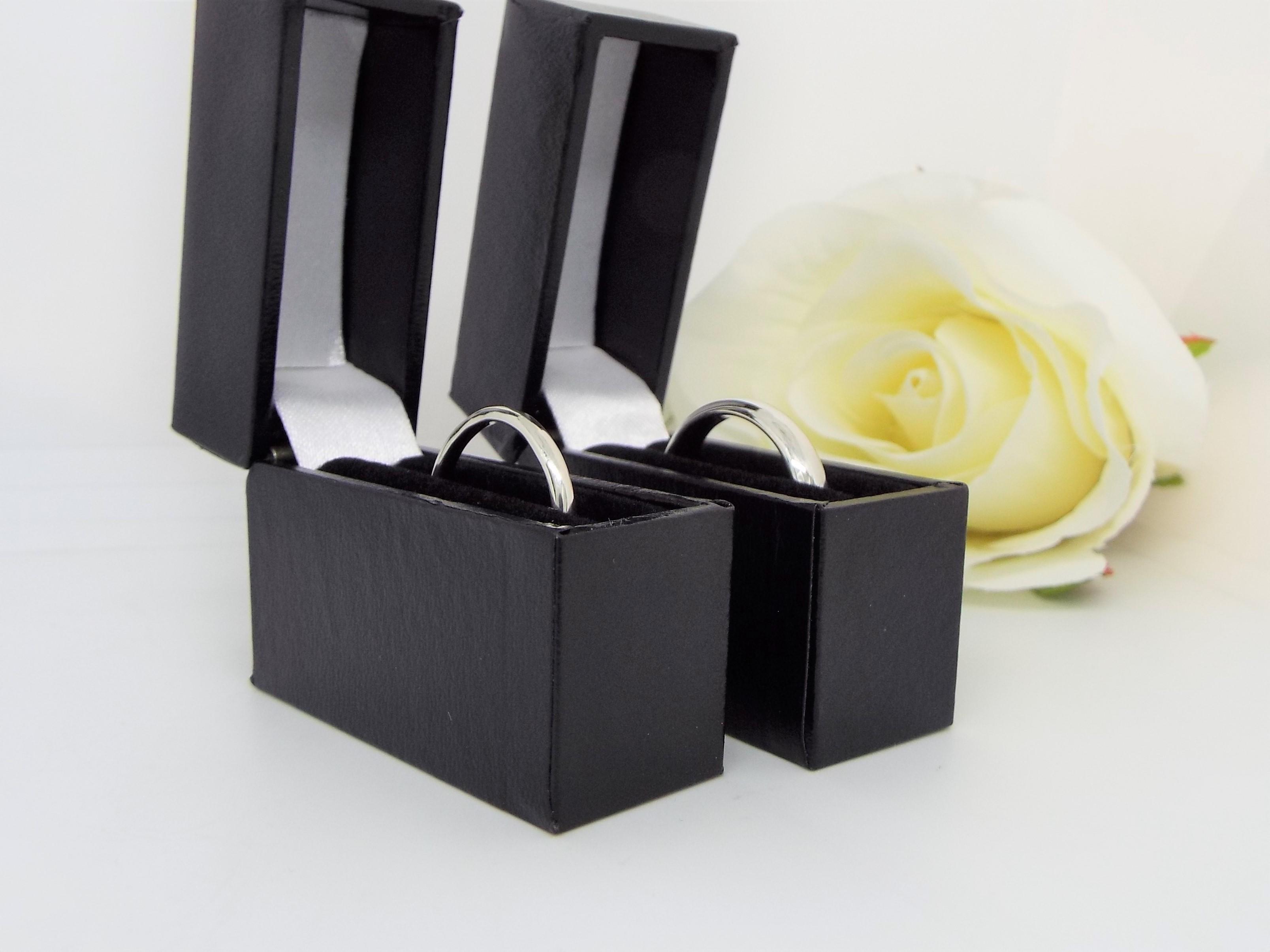 pair of  silver promise rings in boxes