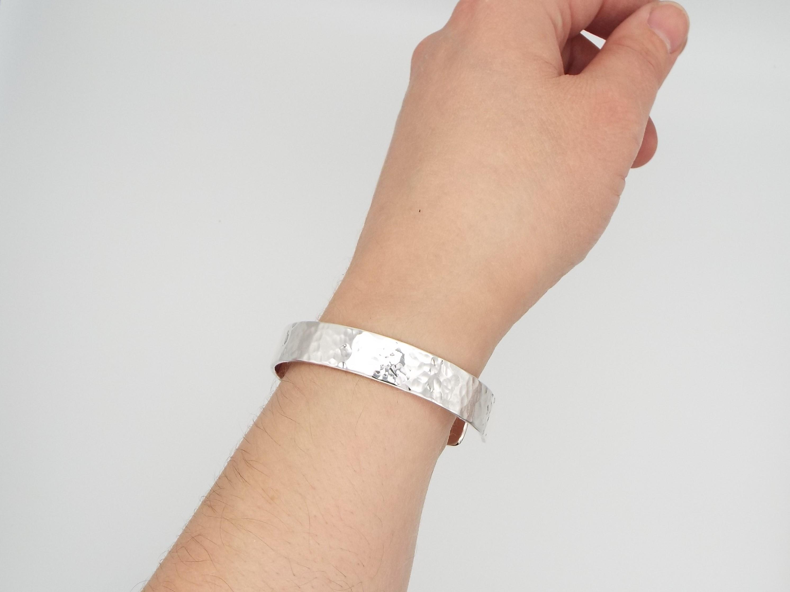woman wearing hammered silver cuff
