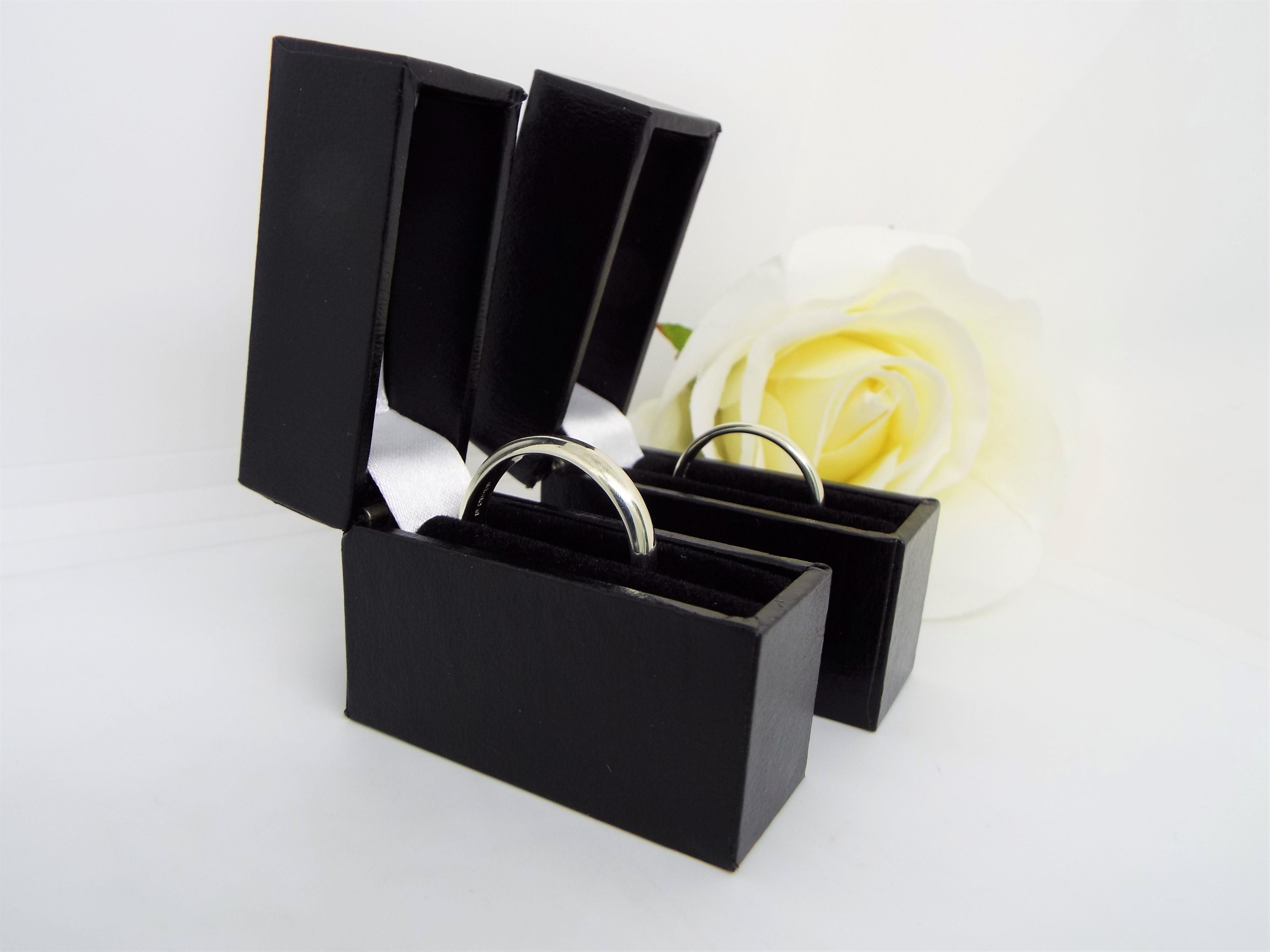 matching white gold wedding rings in boxes