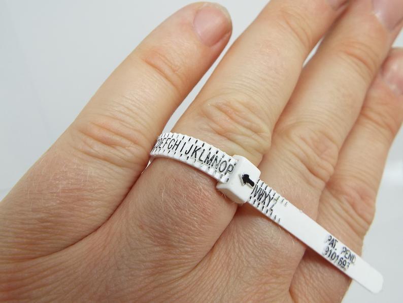 plastic ring sizer on finger