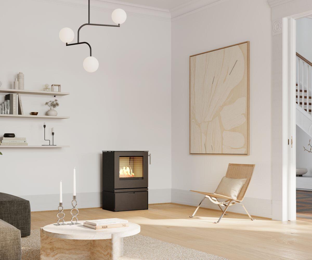 Rais Q-Tee 2 Bio freestanding stove in a pale living room by a round table