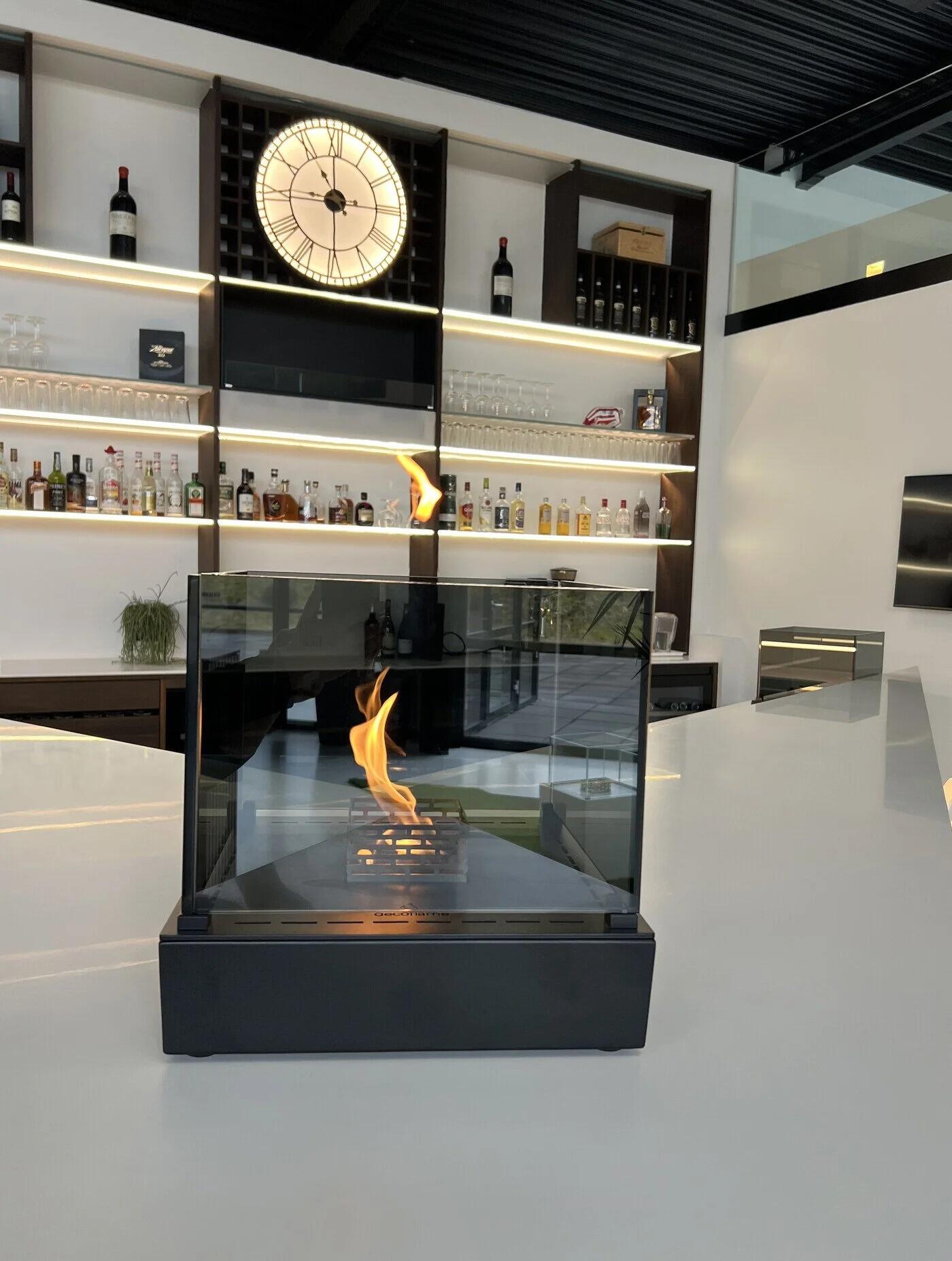 Black Nice Tower table-top fire on a bar counter