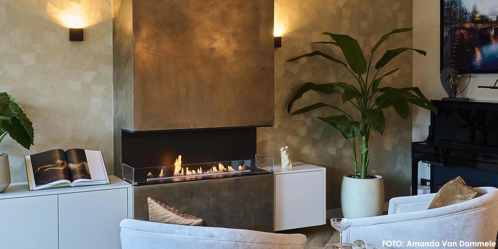 Montreal three-sided fire in a bronze chimney breast between low white cabinets