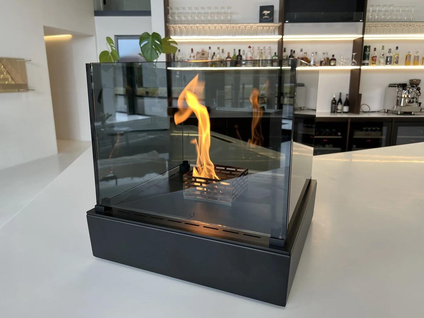 Nice Tower table-top fire in black on a white counter