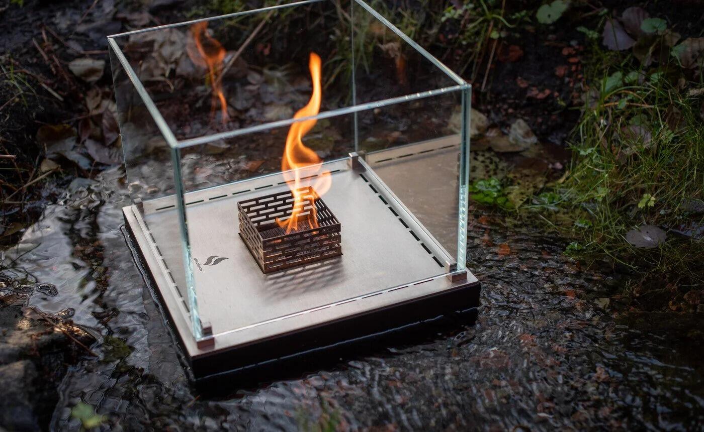 Nice table-top fire lit on a garden path at dusk