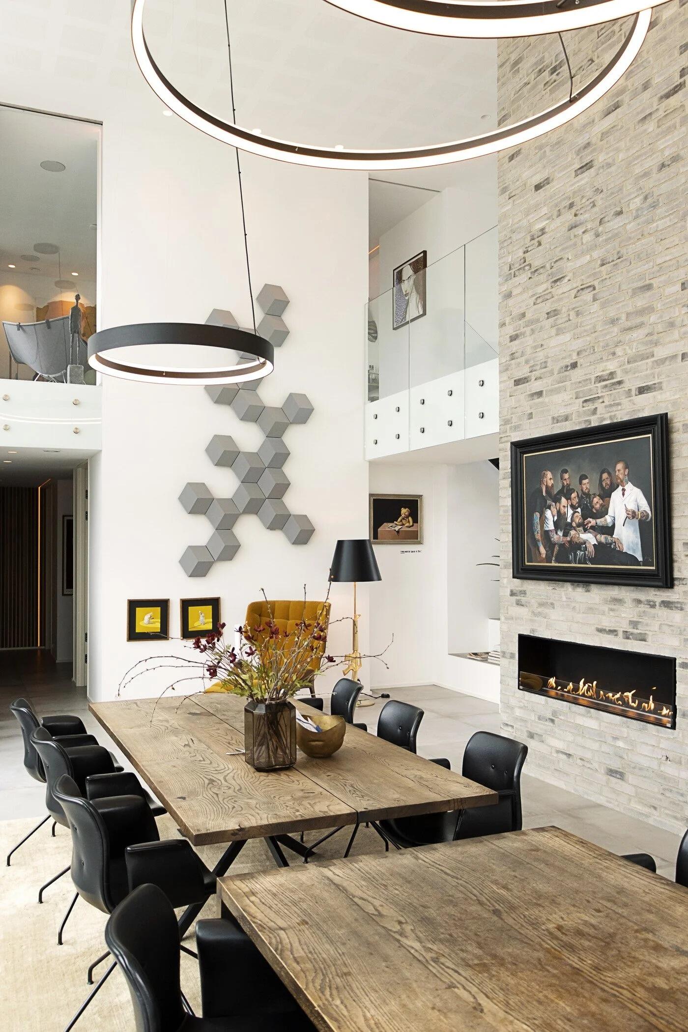 Montreal fire beneath a television in a tall dining room wall