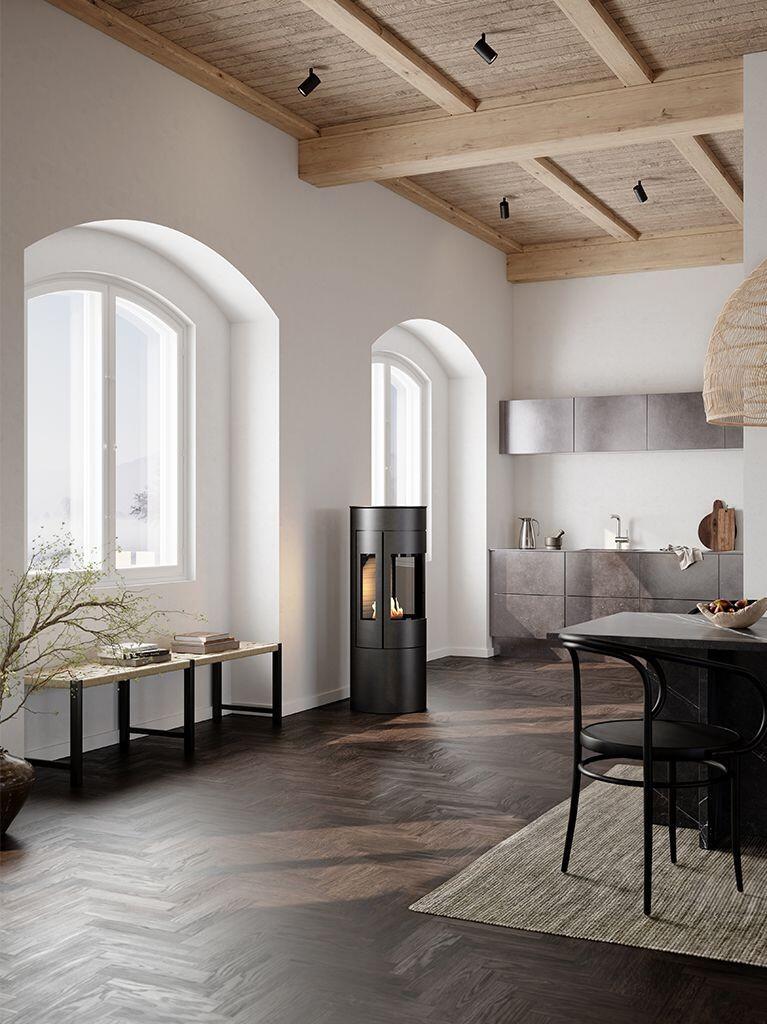 Rais Viva L 120 Bio in black in an open-plan kitchen with a herringbone floor