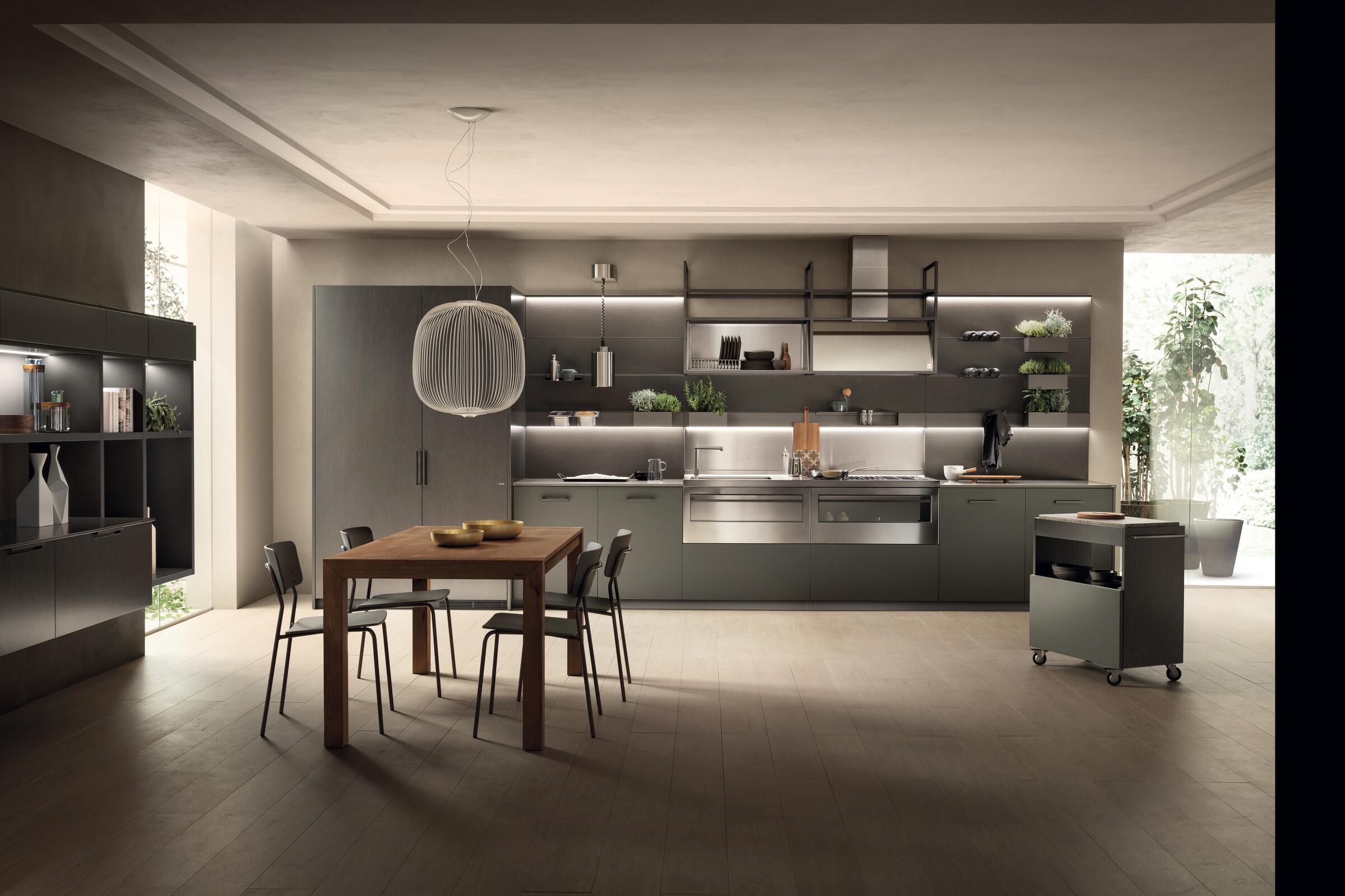 Scavolini MIA by Carlo Cracco kitchen with a professional-style steel back wall and island