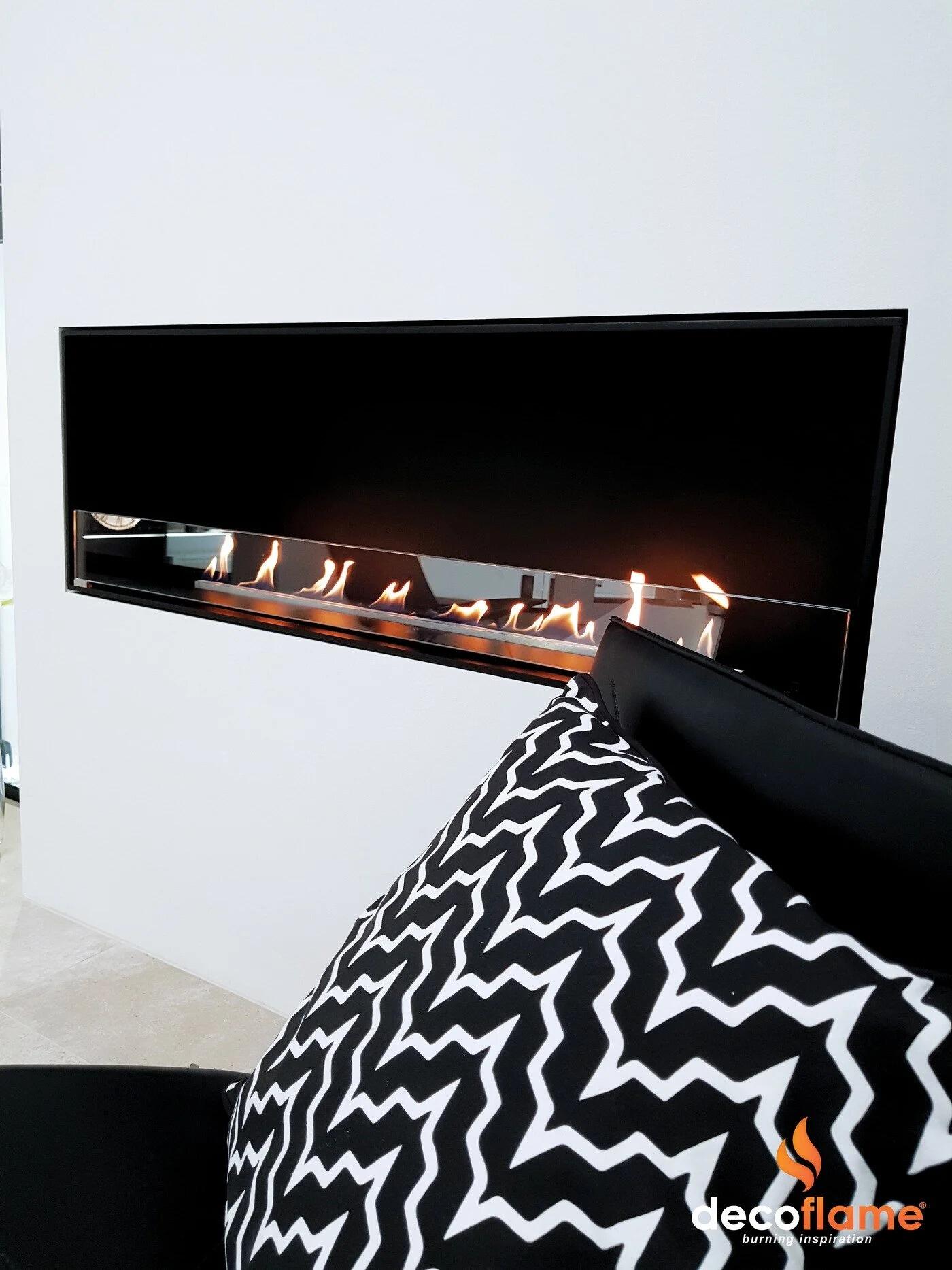 Montreal built-in fire with a patterned cushion in the foreground