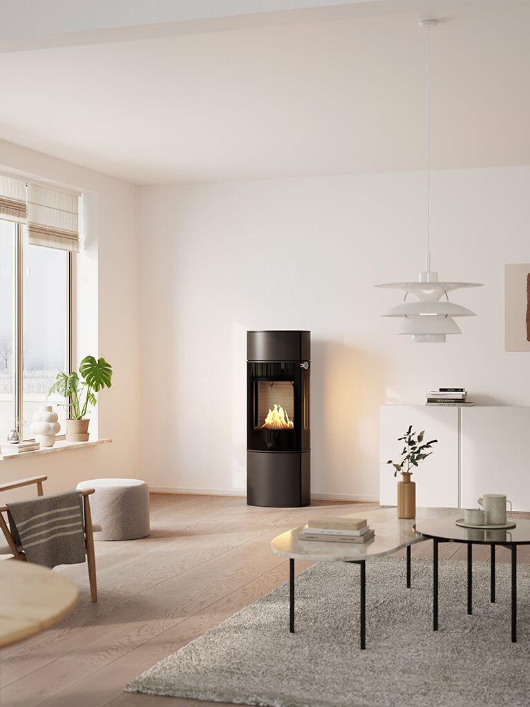 Rais Caro 130 Bio bioethanol stove in black in a bright, airy living room