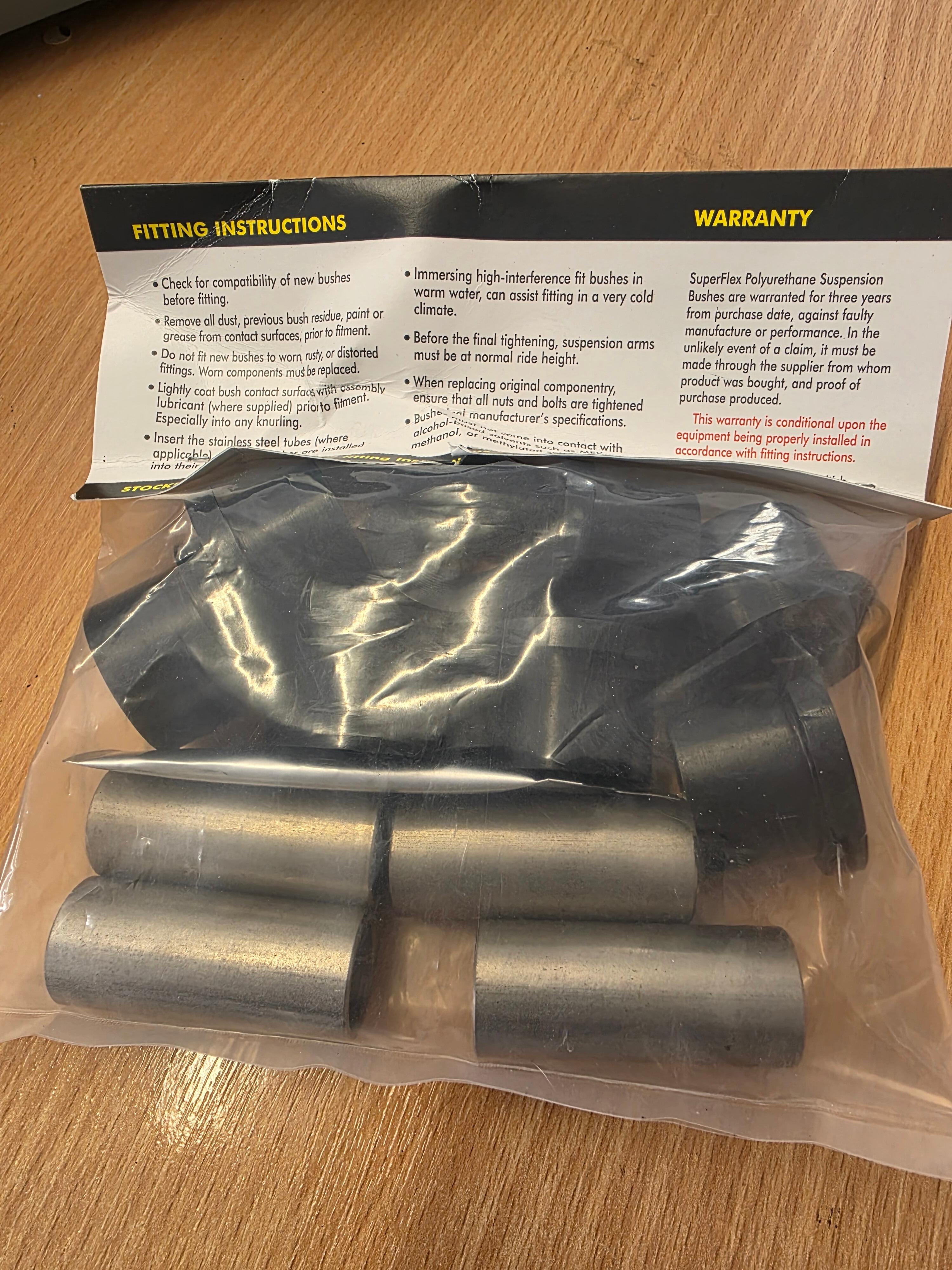 Picture of front king pin suspension bushes in bag.