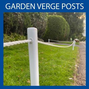 white posts on grass with rope